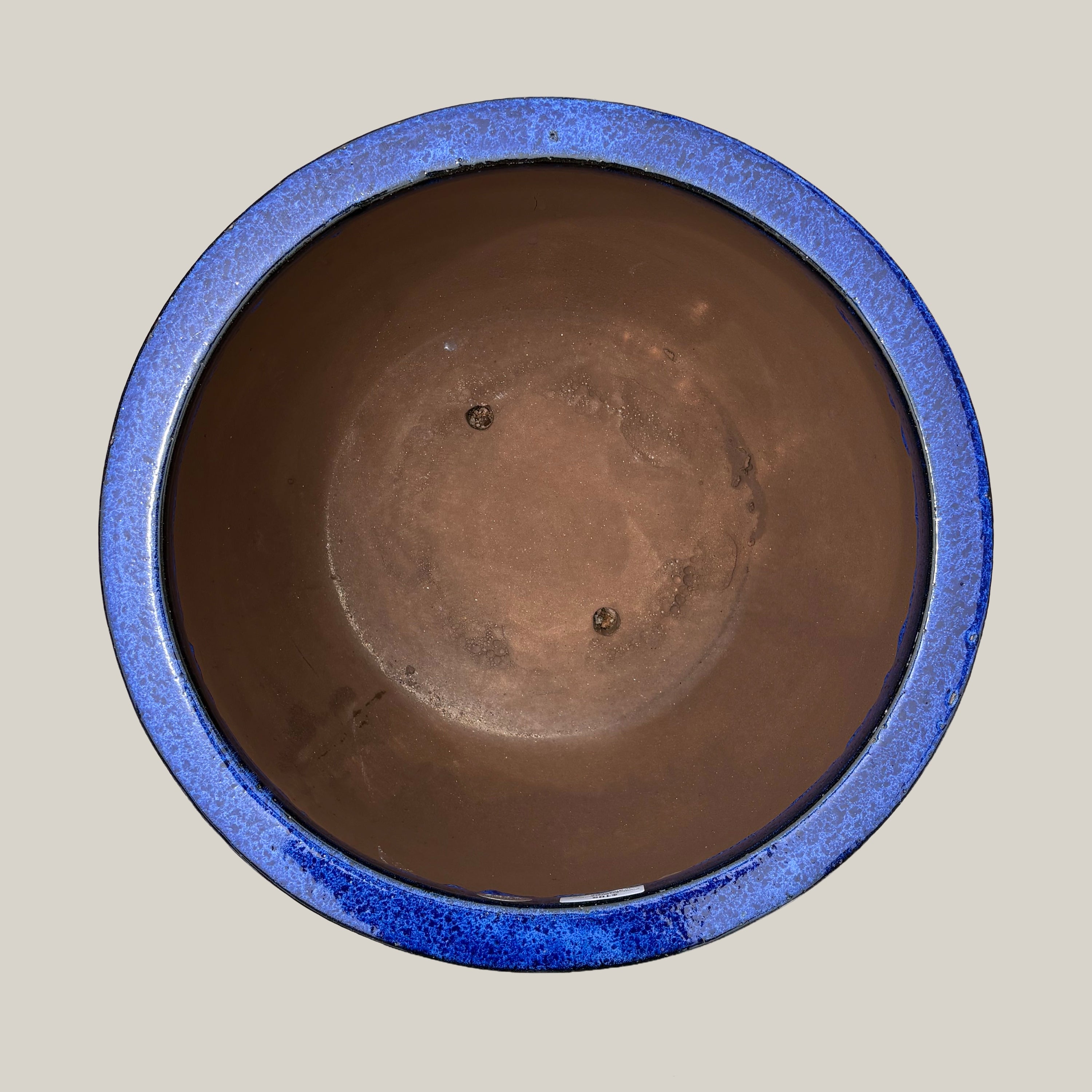 Top view of blue round bowl planter showing its wide opening and rounded bowl design