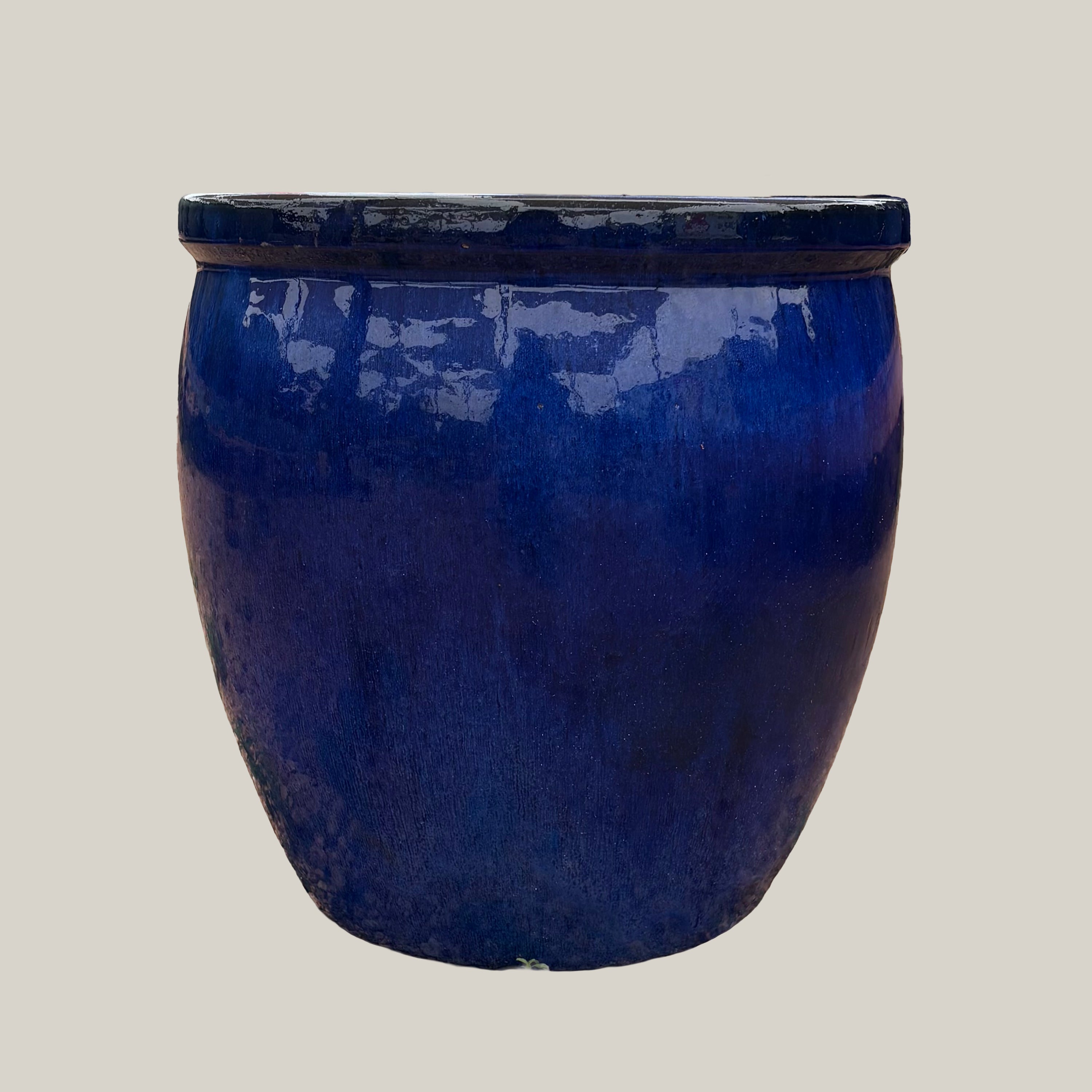 Front view of blue belly planter with bold rounded shape and smooth glossy finish