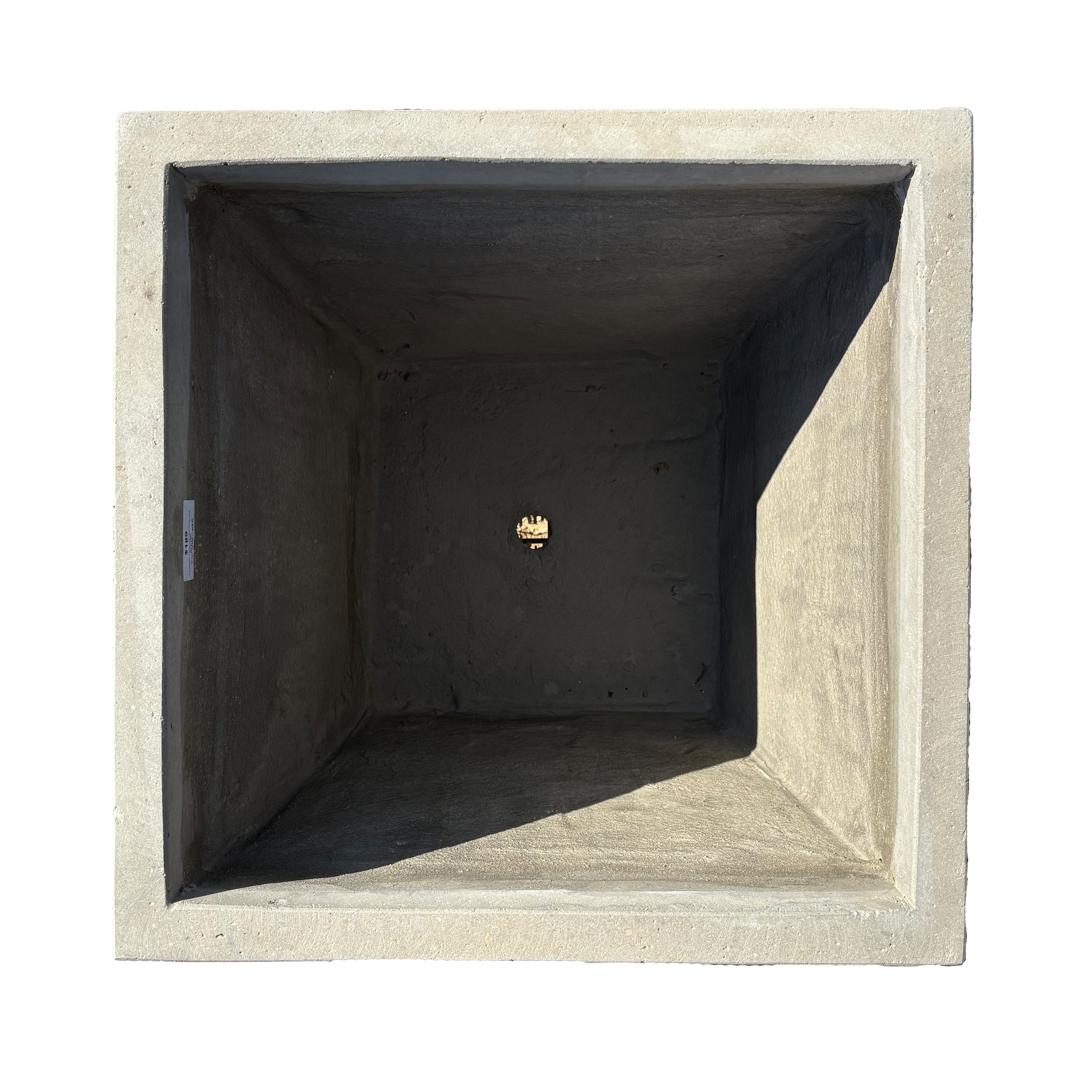 Top-down view of grey tapered square fiberstone planter, emphasizing its square opening and balanced proportions.