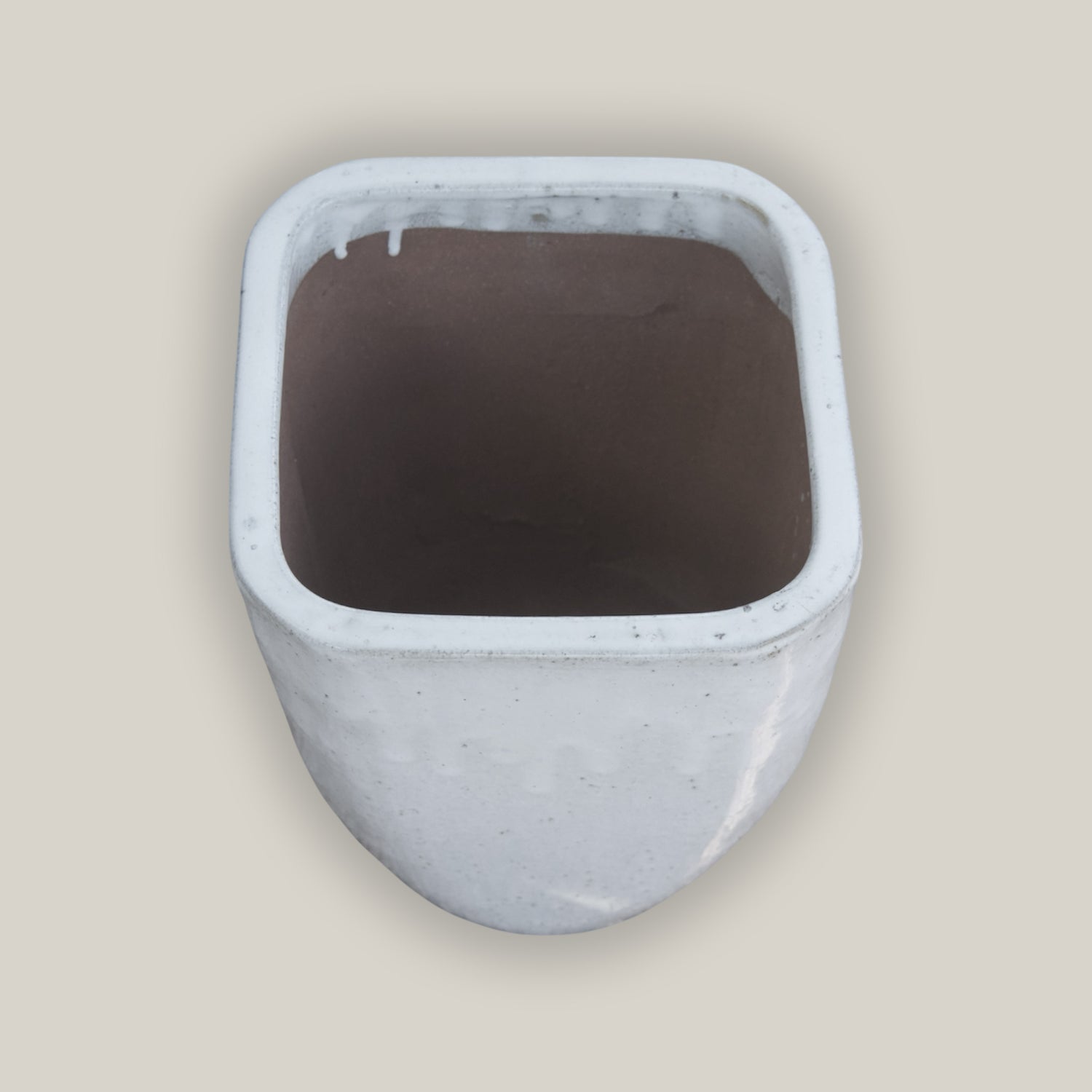 Angled White square planter with modern tapered design