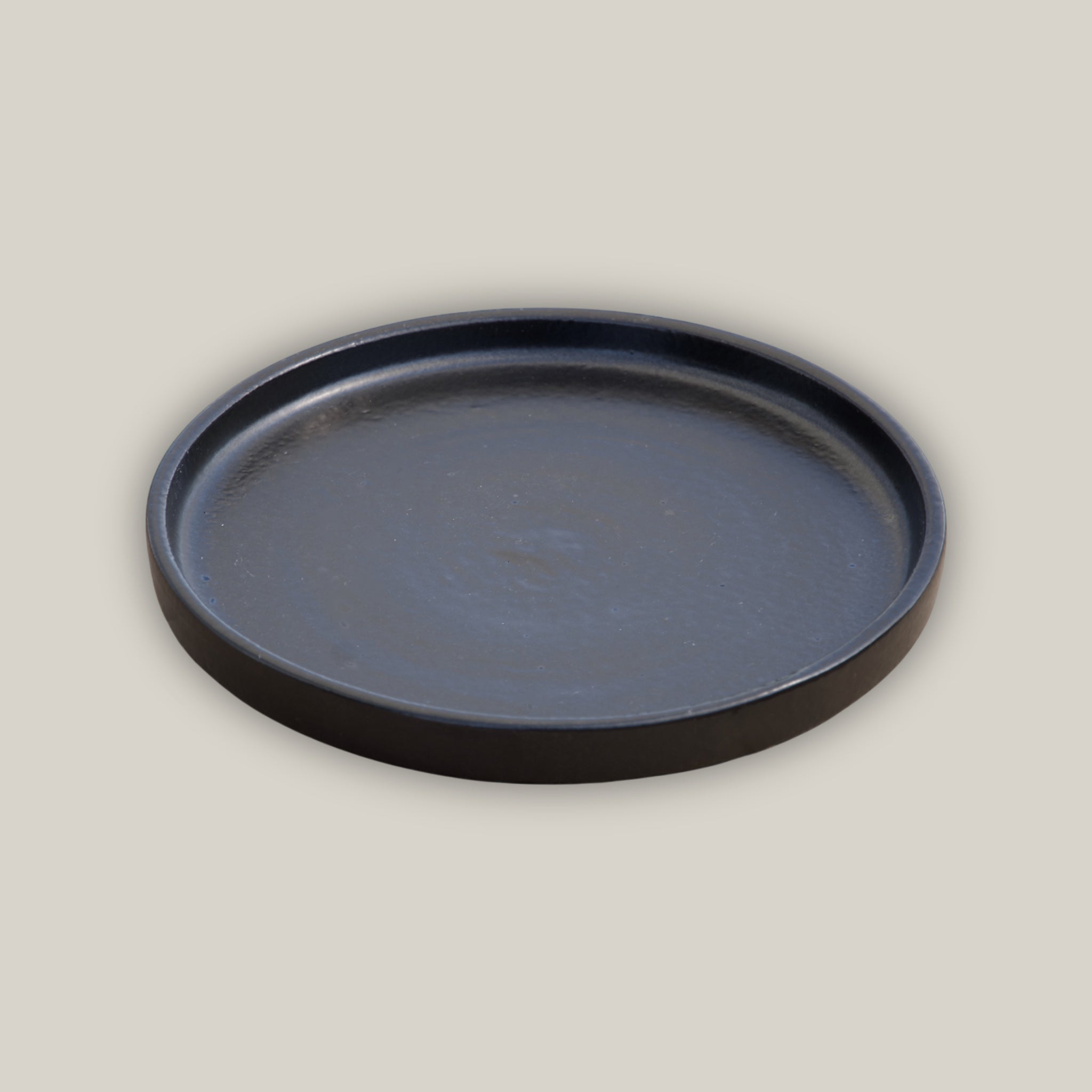 Round black ceramic plant saucer