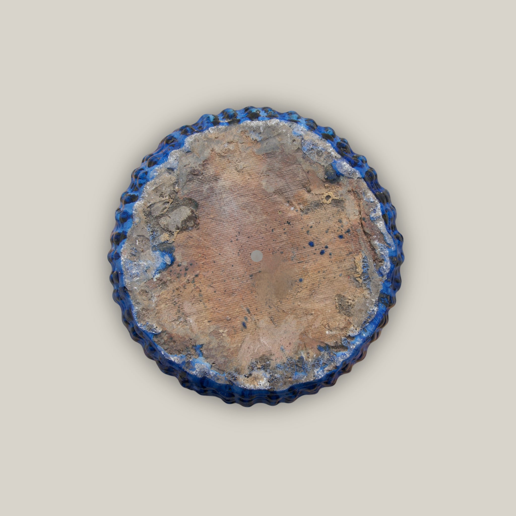 Bottom of Tall blue flower pot with lattice design