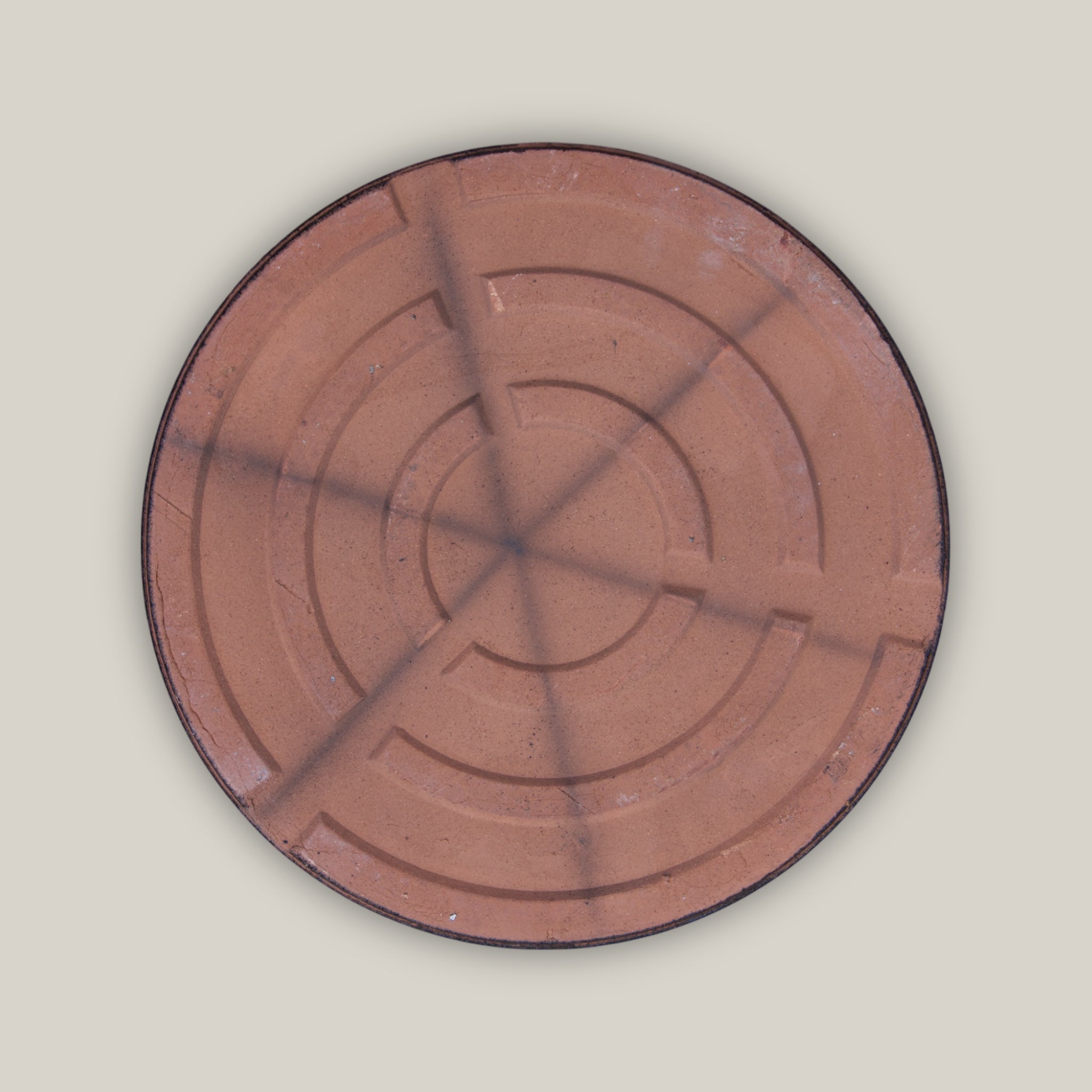 Back of Round black ceramic plant saucer