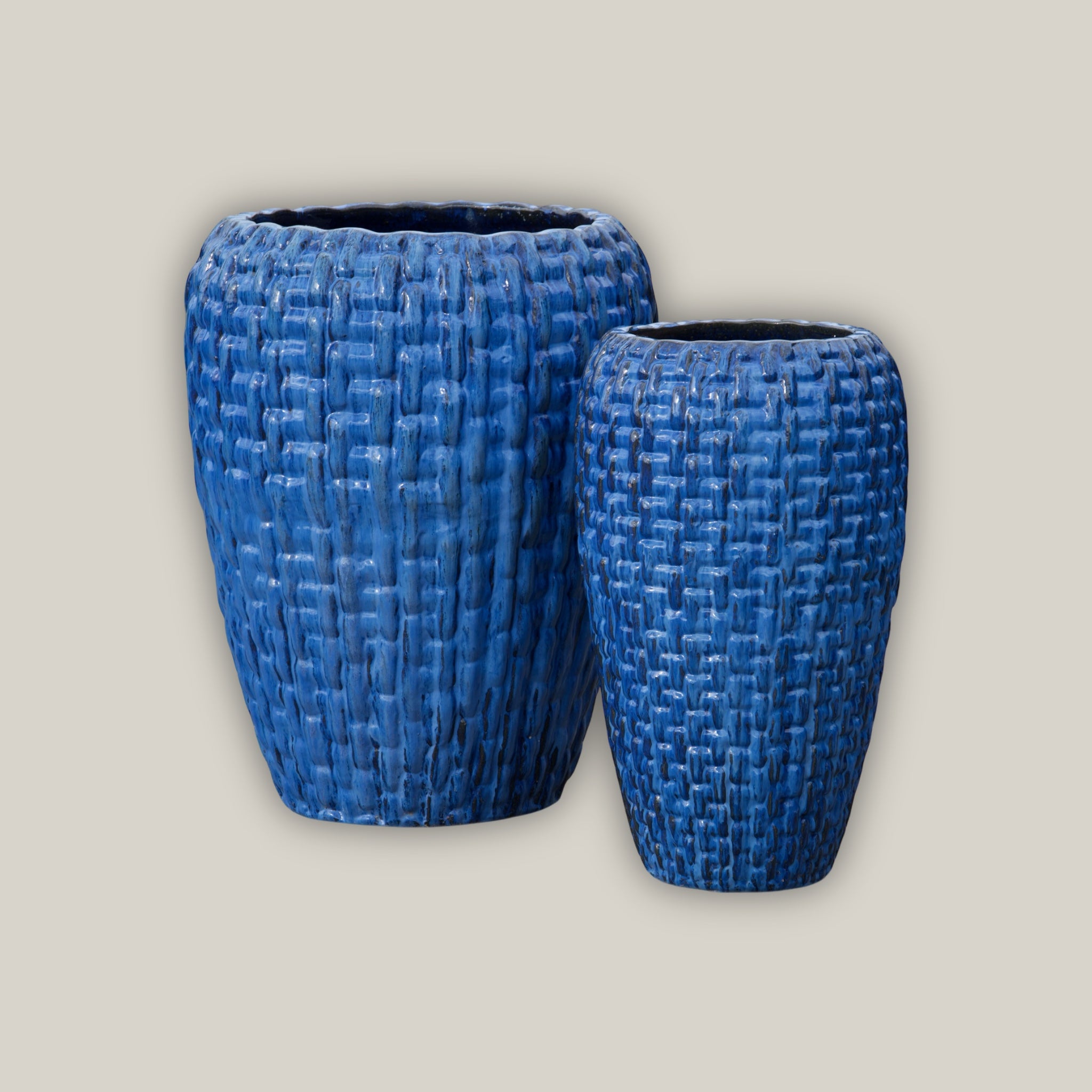Tall blue flower pot with lattice design
