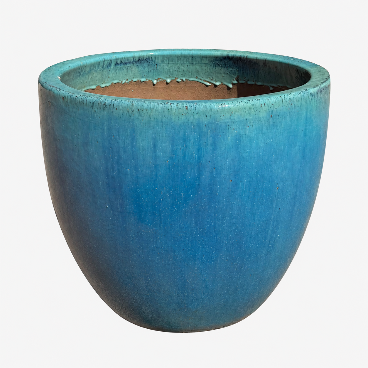A ceramic planter with a rounded, wide rim shape, featuring a textured blue glaze with a subtle greenish-teal undertone and a brown clay interior, shown against a plain white background.
