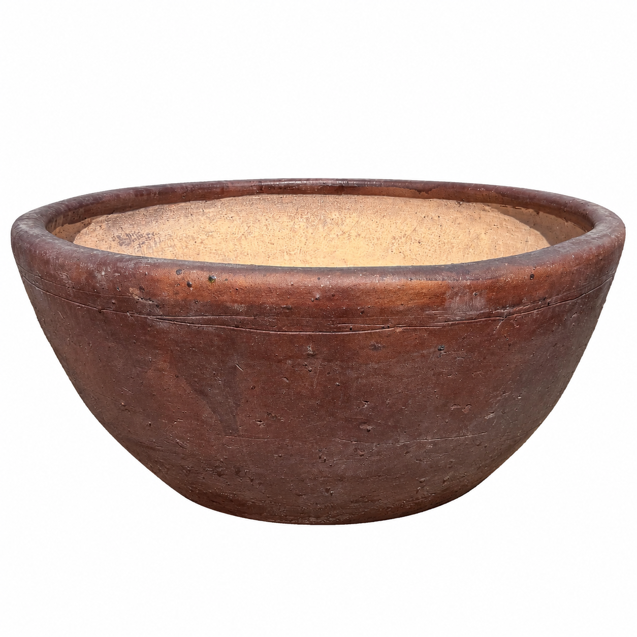 A handcrafted bowl planter with a warm reddish-brown exterior and a light tan sandy interior, shown against a plain white background.