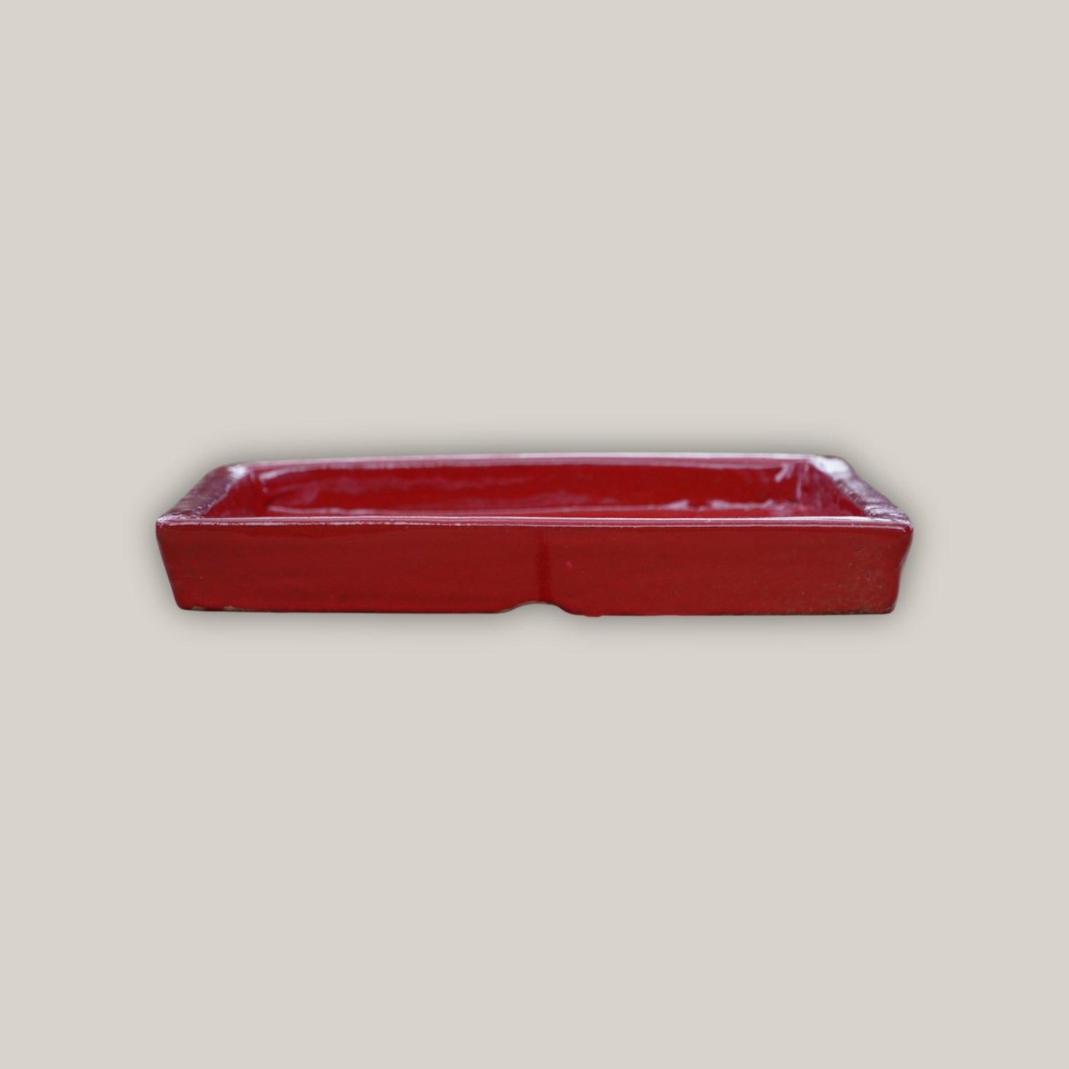 Bright red square plant saucer made from ecofriendly clay