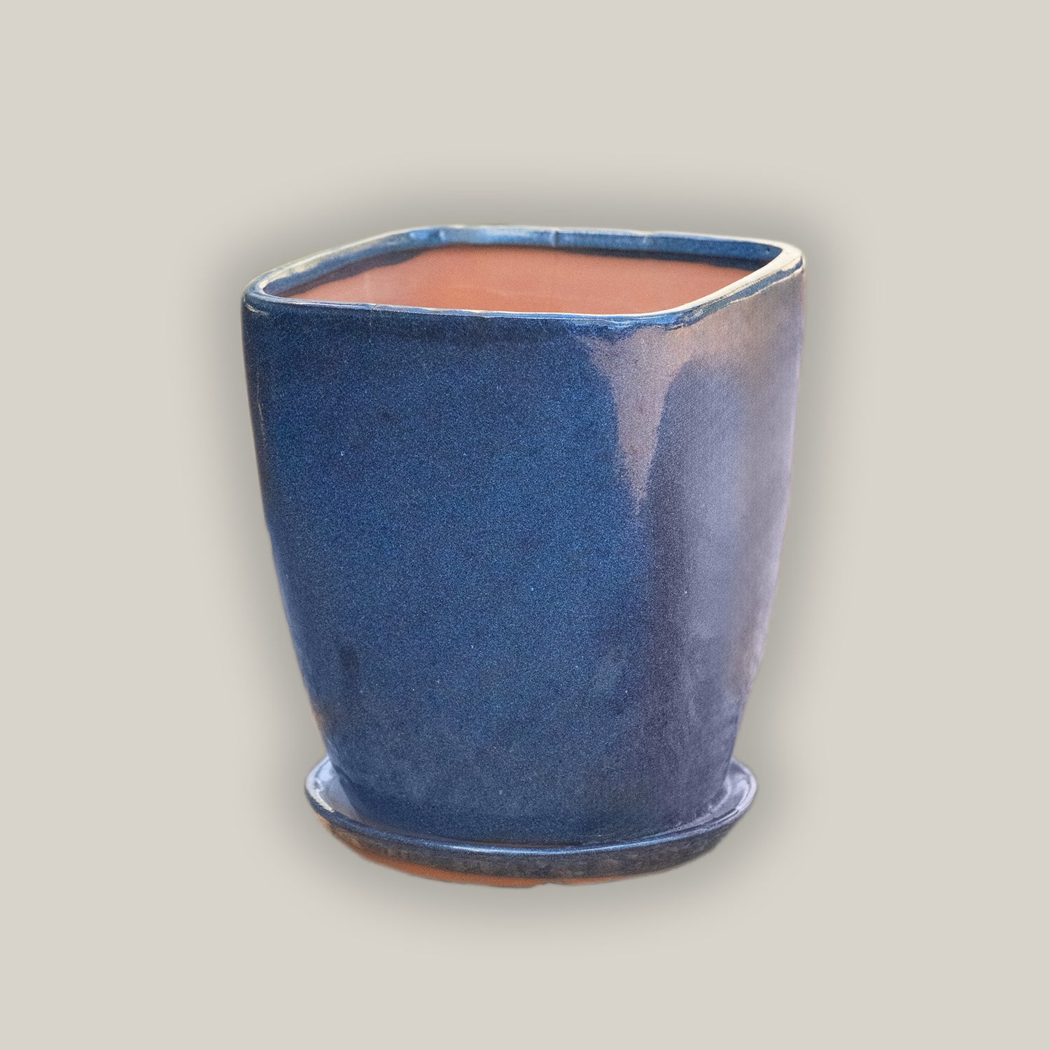 Ceramic dark blue tapered planter with saucer