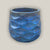 Turquoise round ceramic planter with modern wave-shaped ridges
