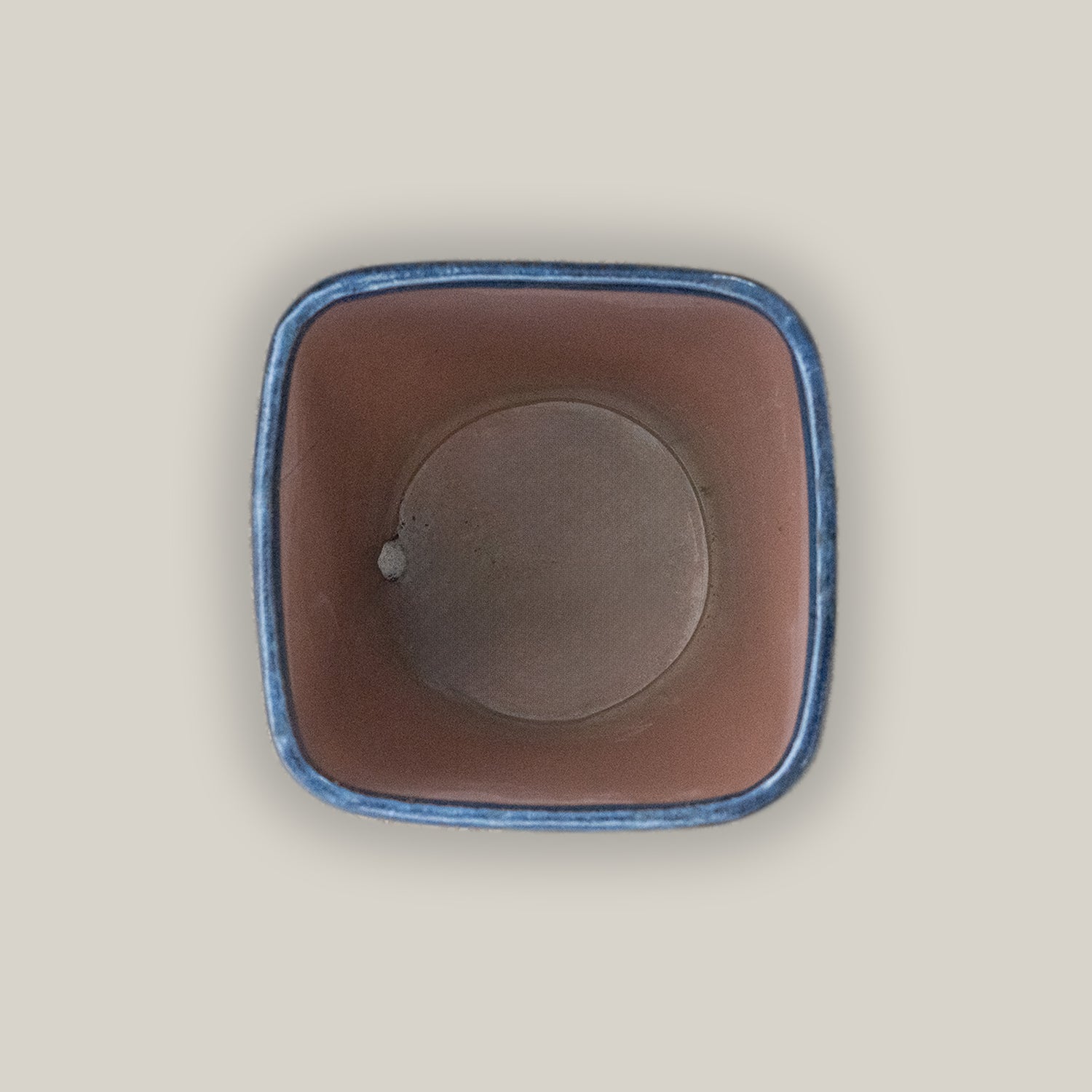 Top view of Ceramic dark blue tapered planter with saucer