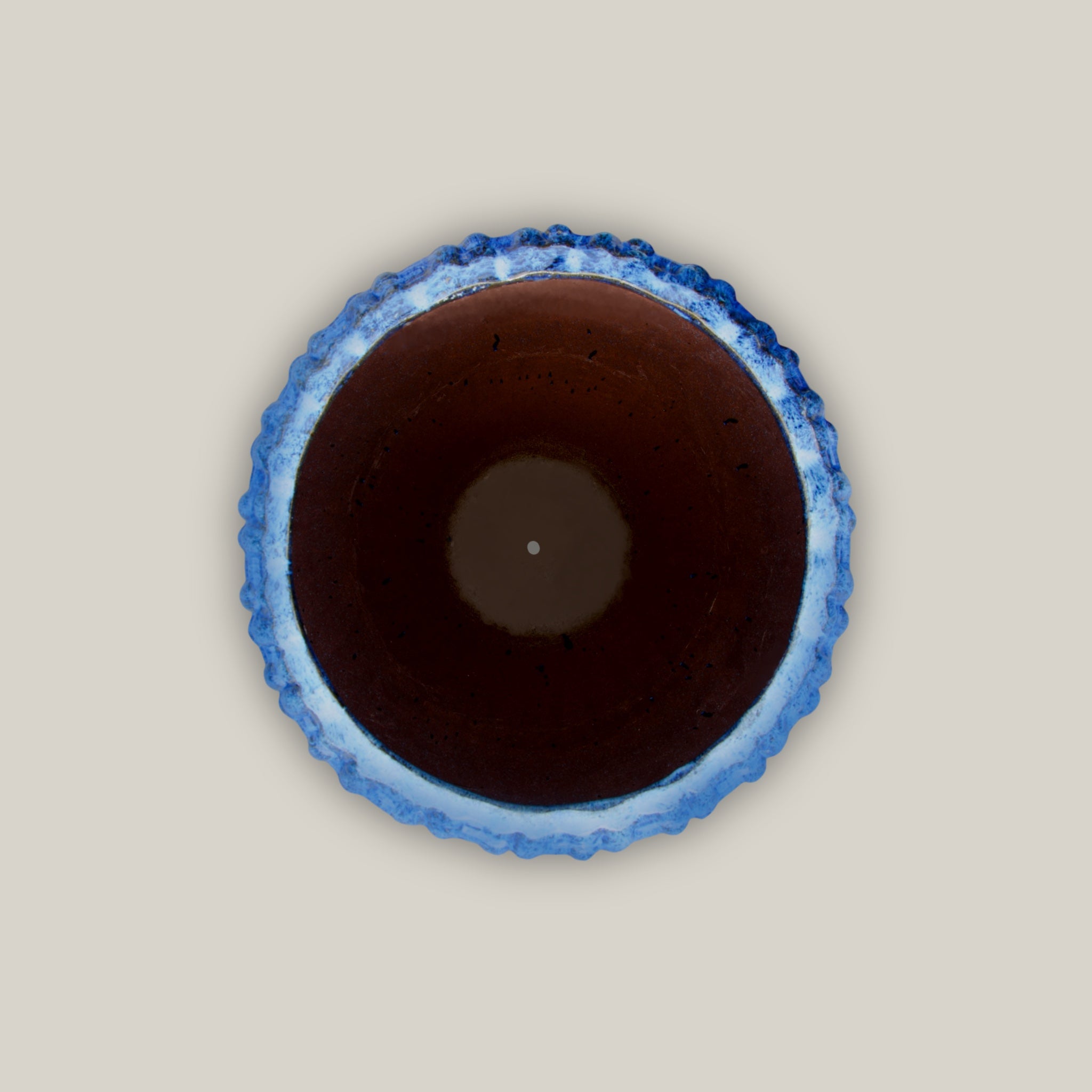 Top view of Tall blue flower pot with lattice design