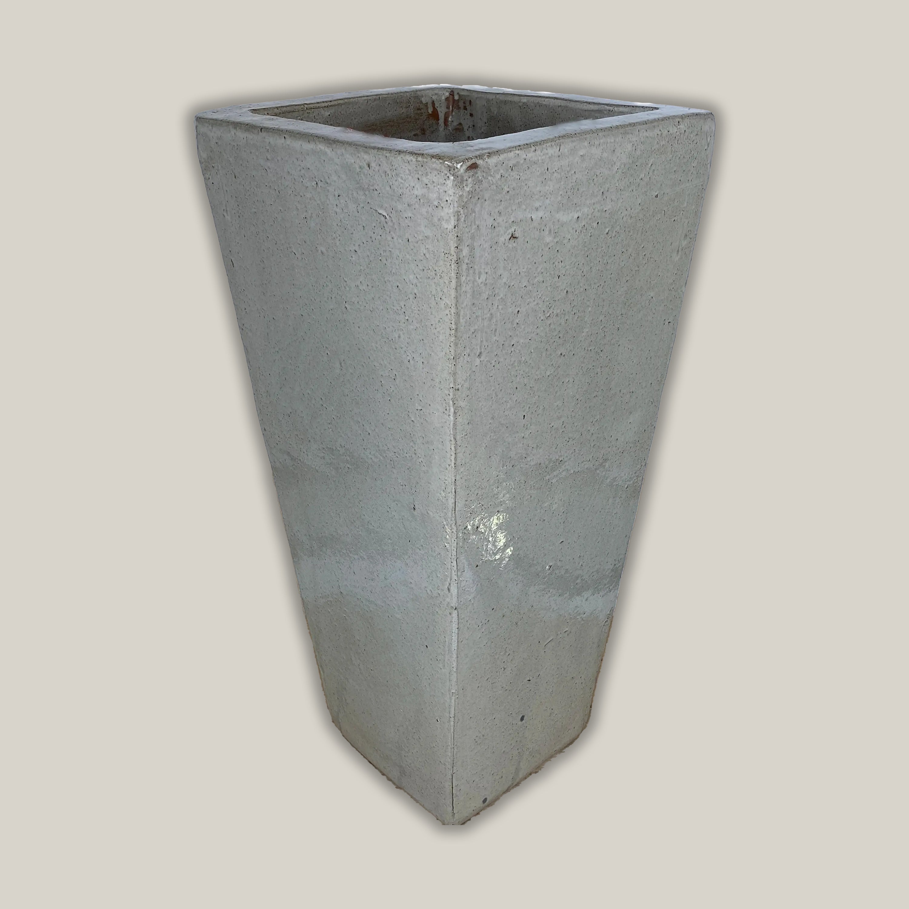 Tall white ceramic planter with glossy square wedge design