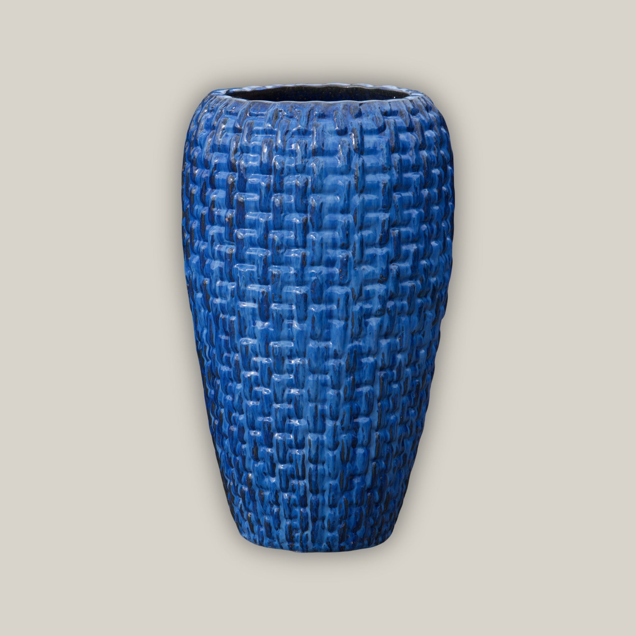 Tall blue flower pot with lattice design