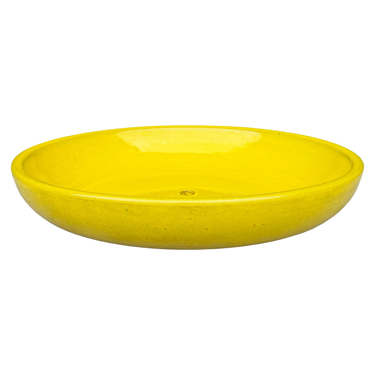 Angled view of a wide, shallow atomic yellow ceramic succulent bowl with a glossy bright-yellow interior, a rounded rim and a central drainage hole