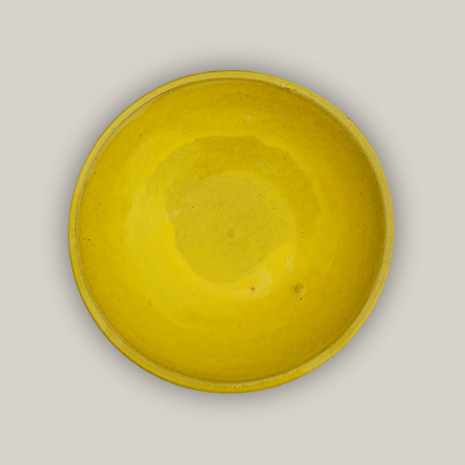 Top view of Yellow ceramic bird bath with hand-glazed finish