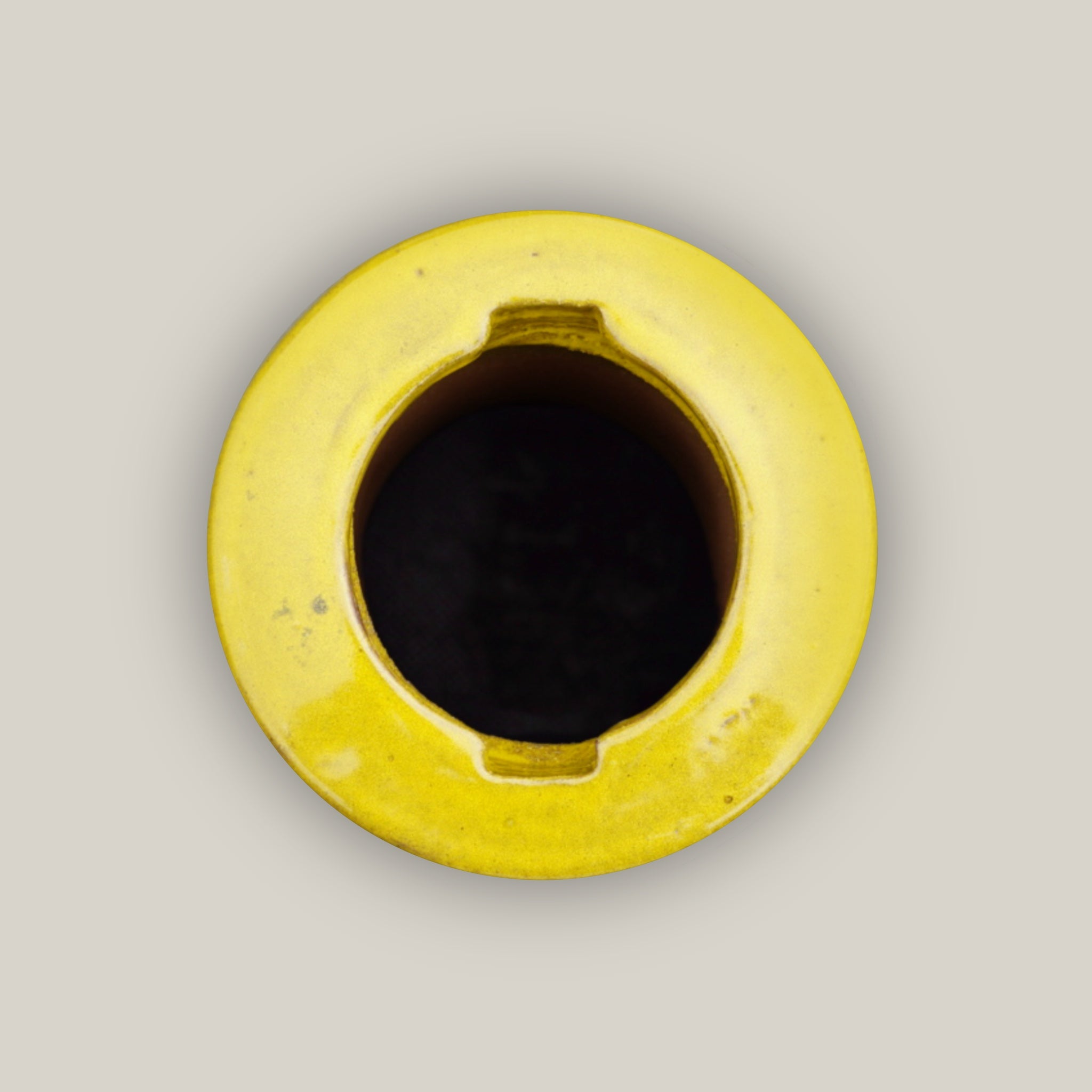 Bottom of Yellow ceramic bird bath with hand-glazed finish