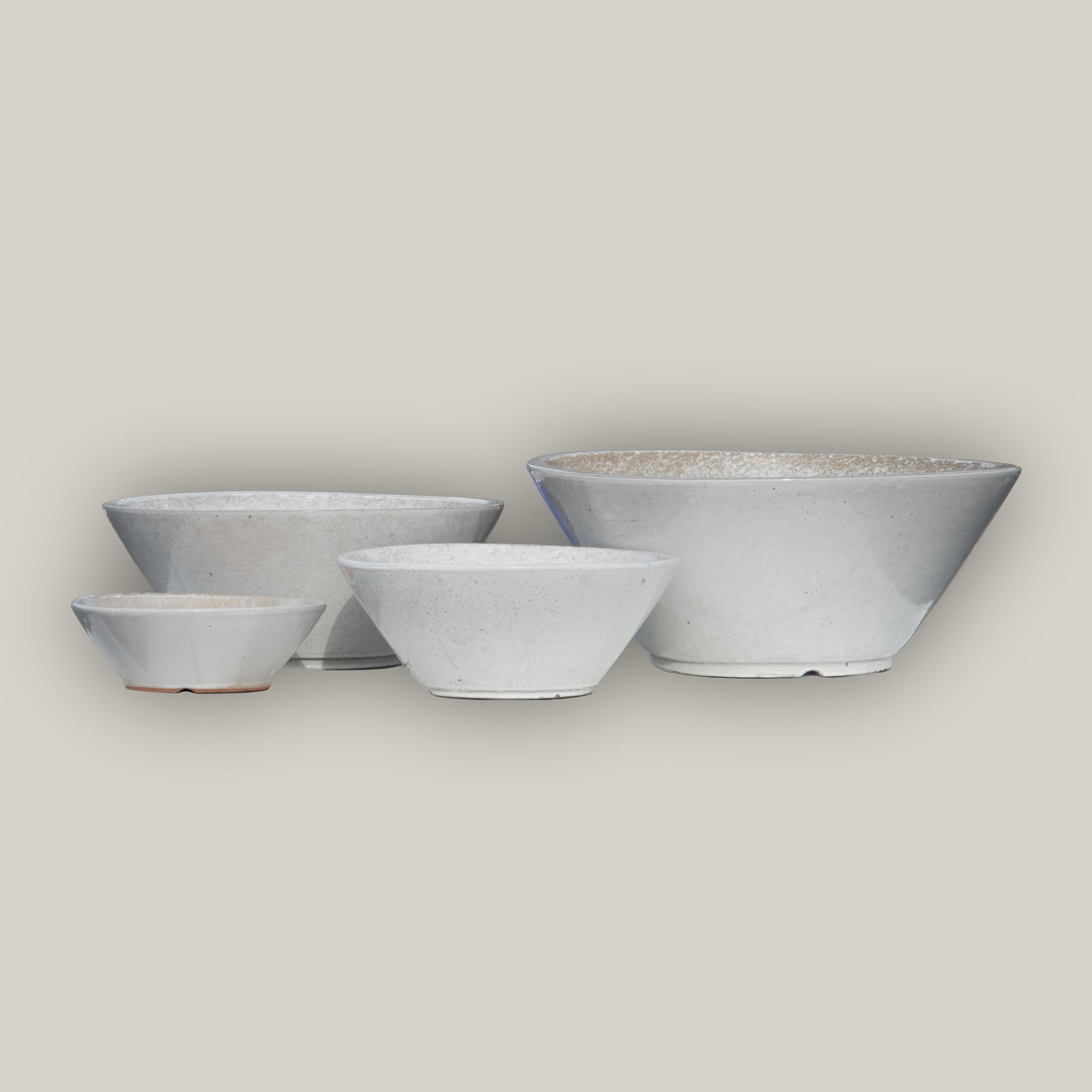 White cone shaped low wide planter set of 4