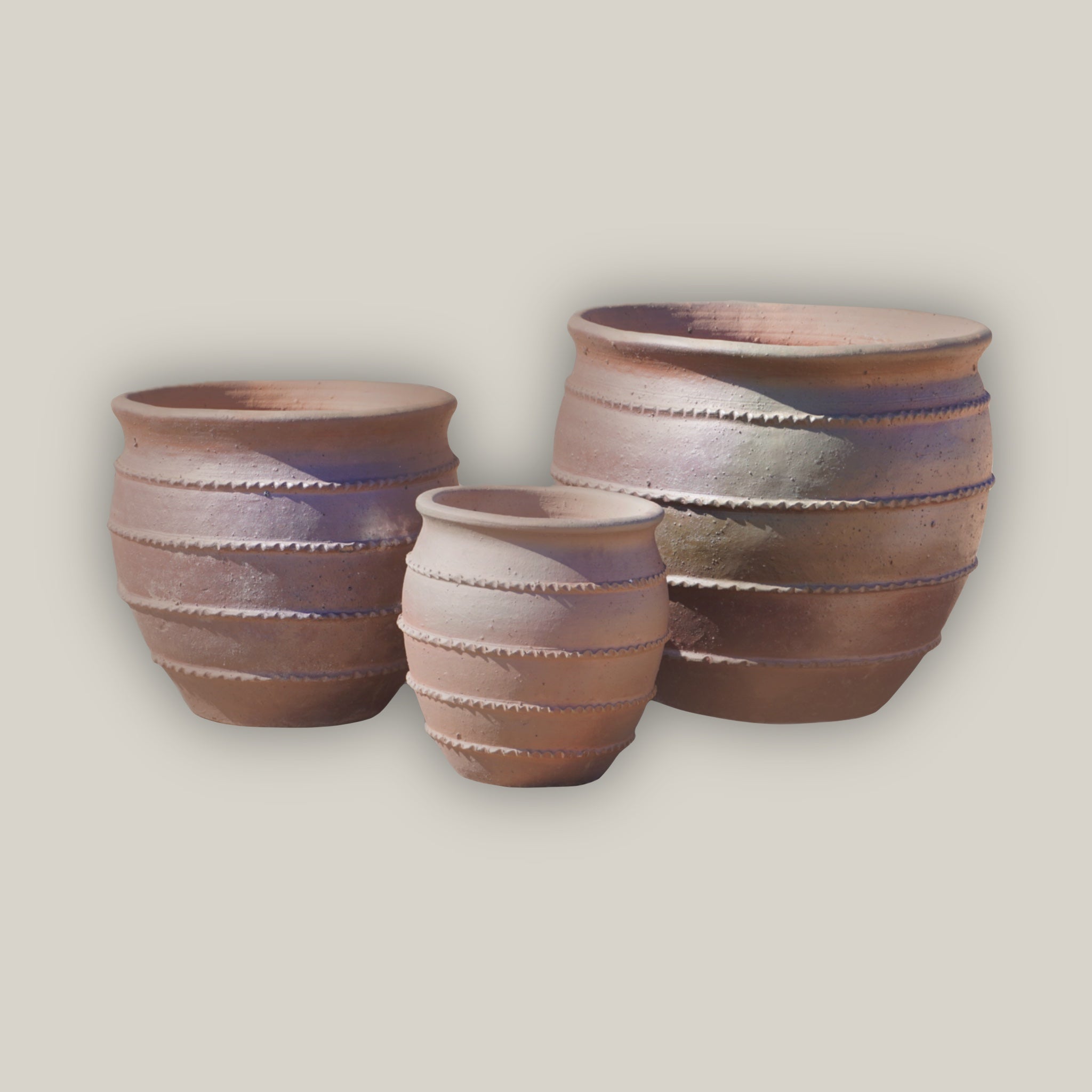 Tapered rustic clay flower pot with three-rim design
