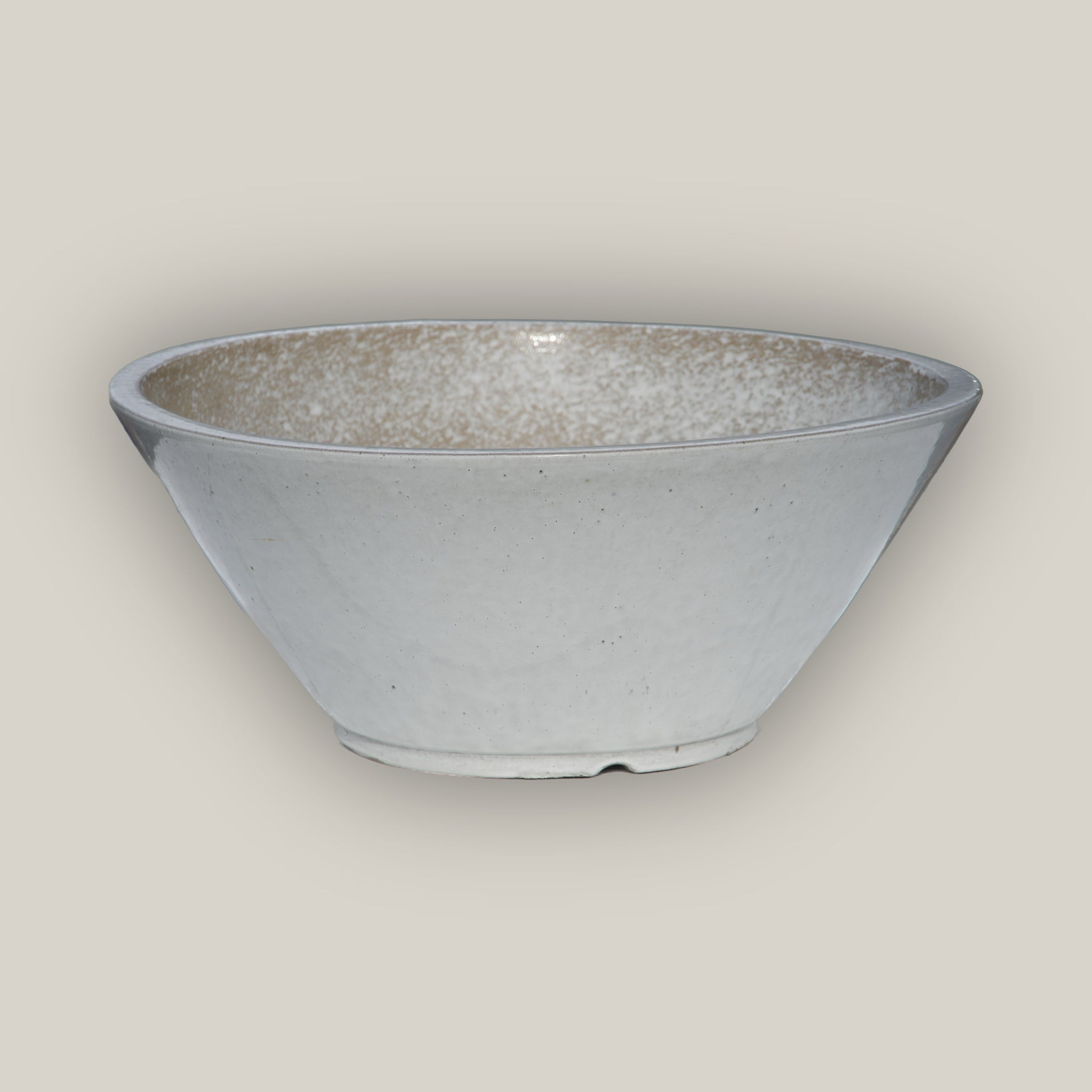 White cone shaped low wide planter