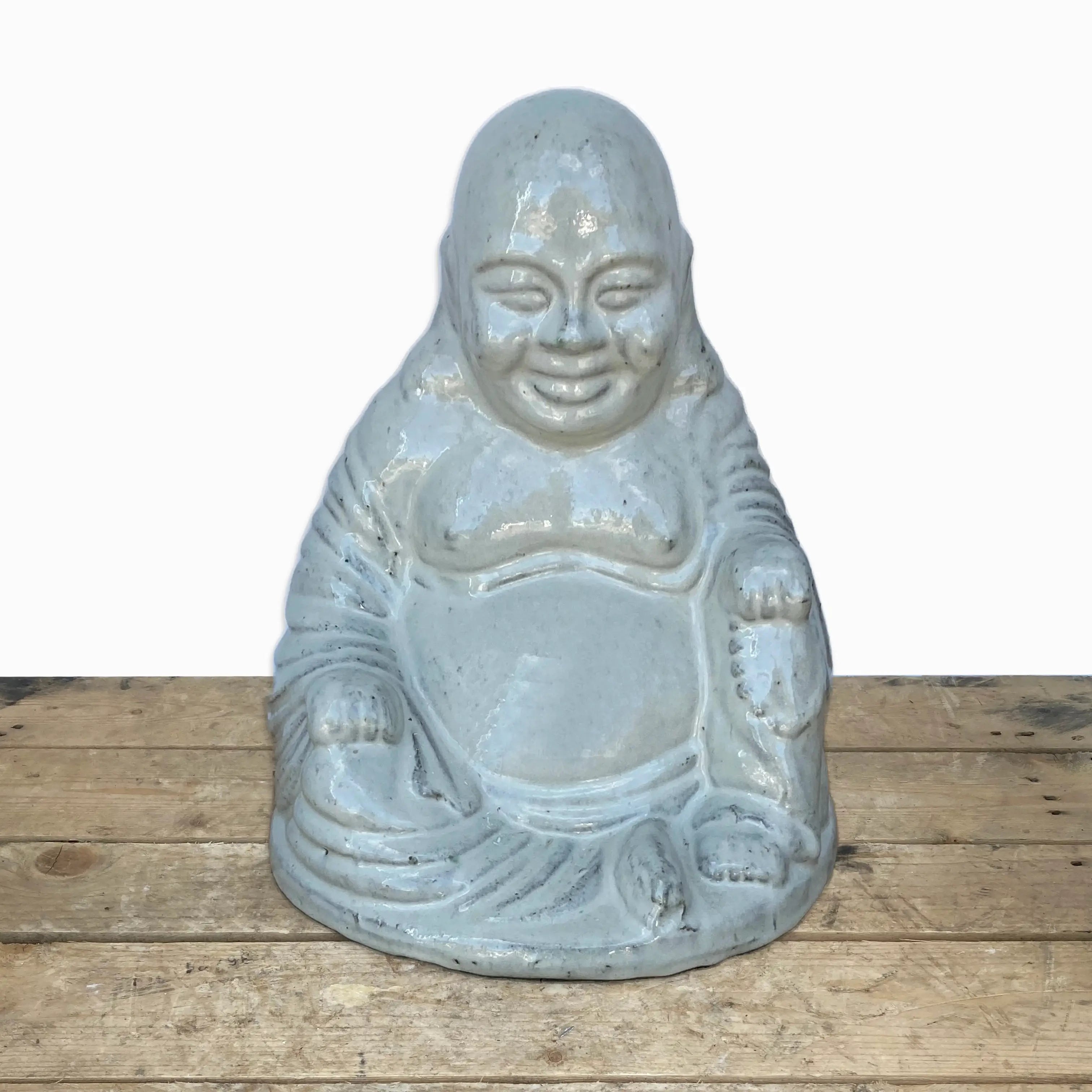 Glossy white smiling buddha statue
