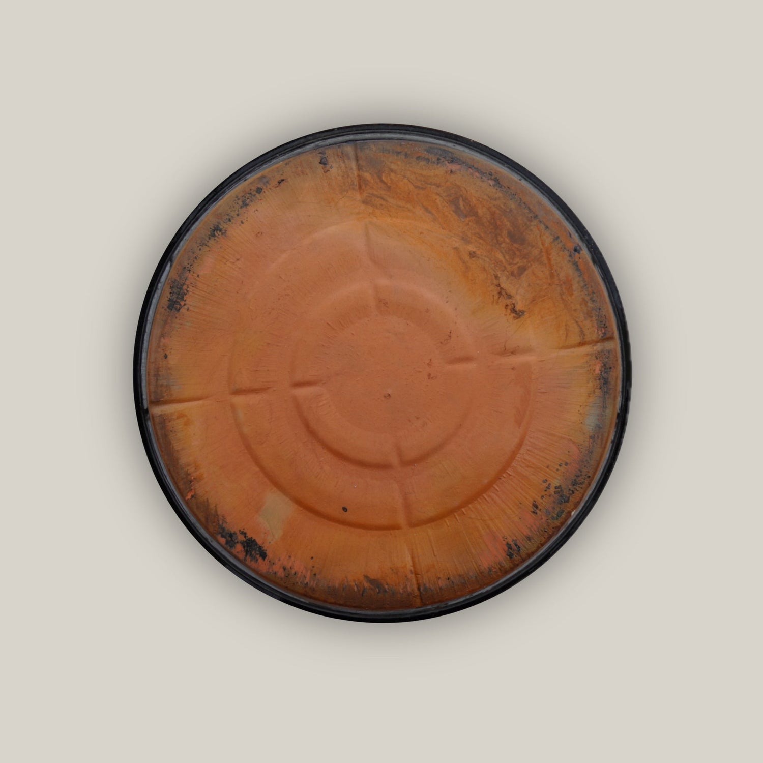 Back of Round shiny black plant saucer