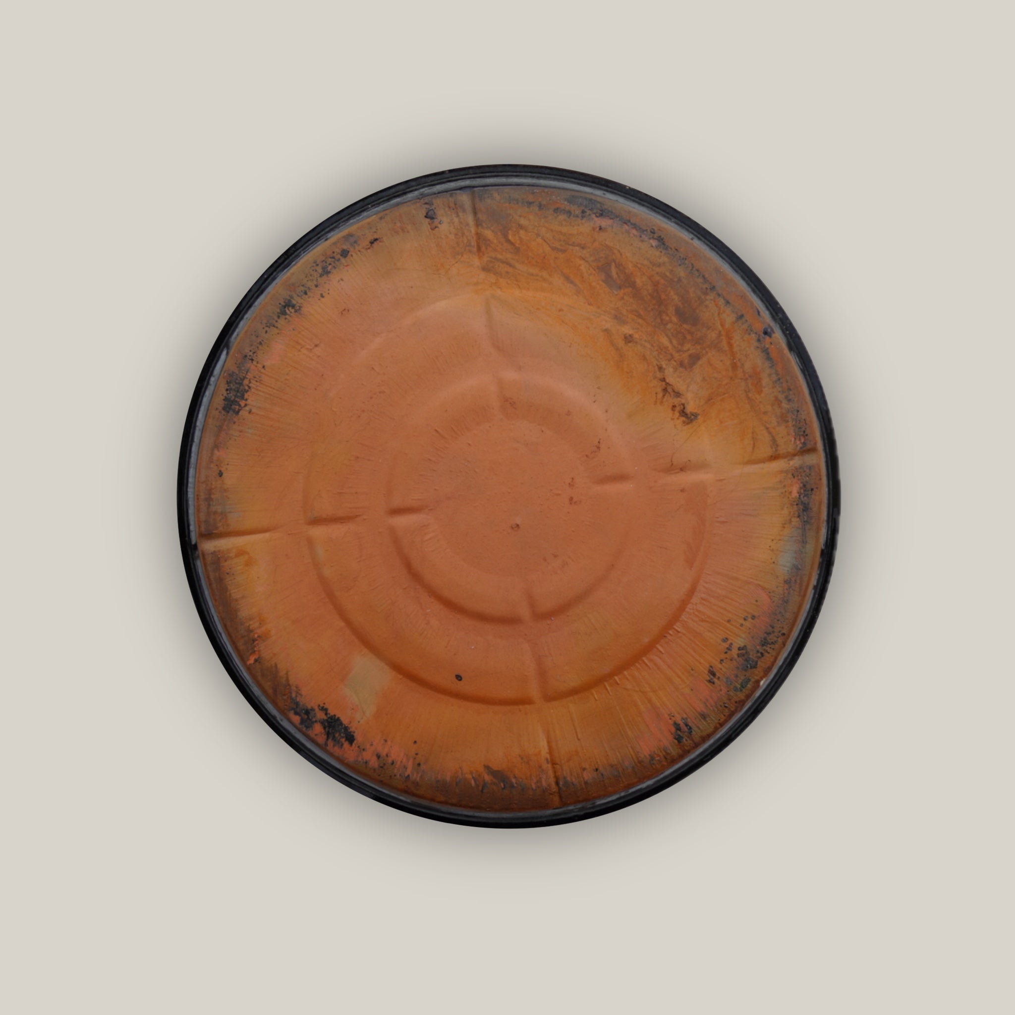 Back of Round shiny black plant saucer