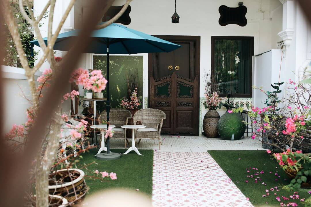 Porch with variety of pots and flowers