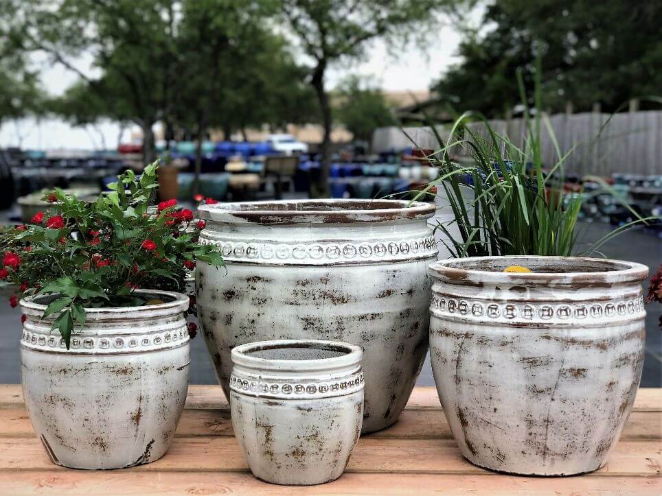 Outdoor wedding decorations featuring elegant pottery accents