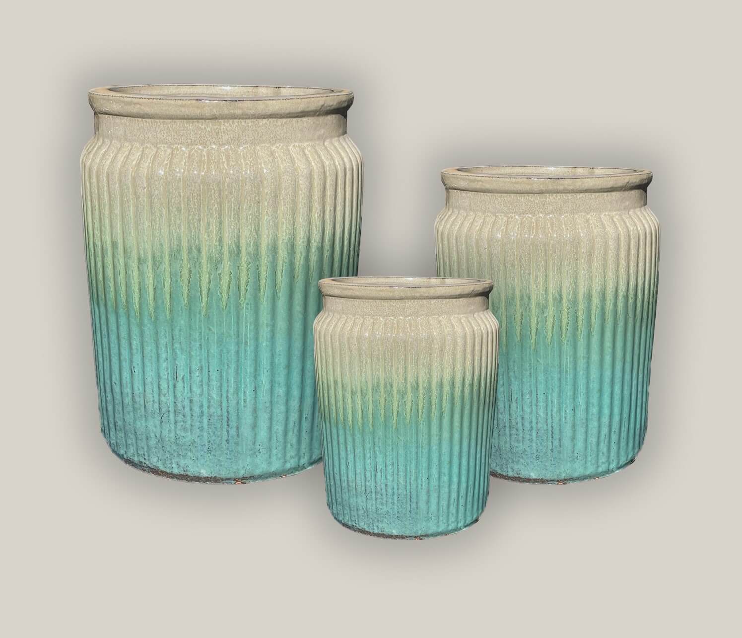 Collection of sleek cylinder planters in various sizes