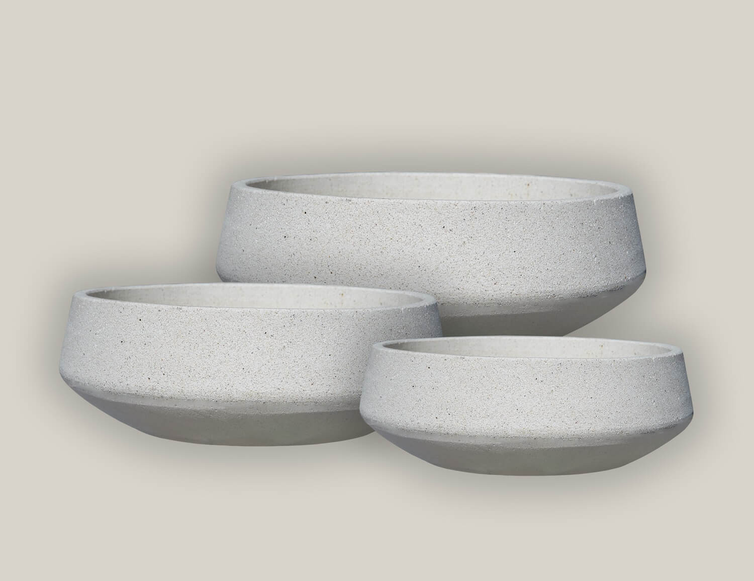Set of sleek geometric planters in neutral colors