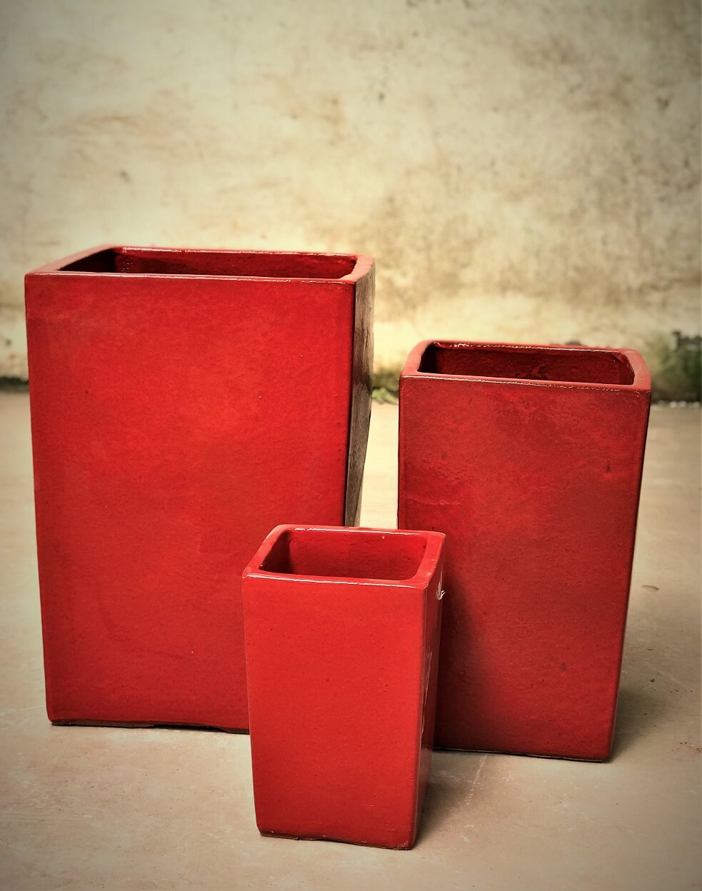 Red ceramic planters in different sizes