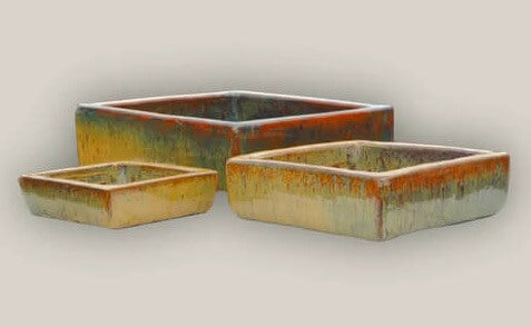 Collection of large and small square planters in natural hues