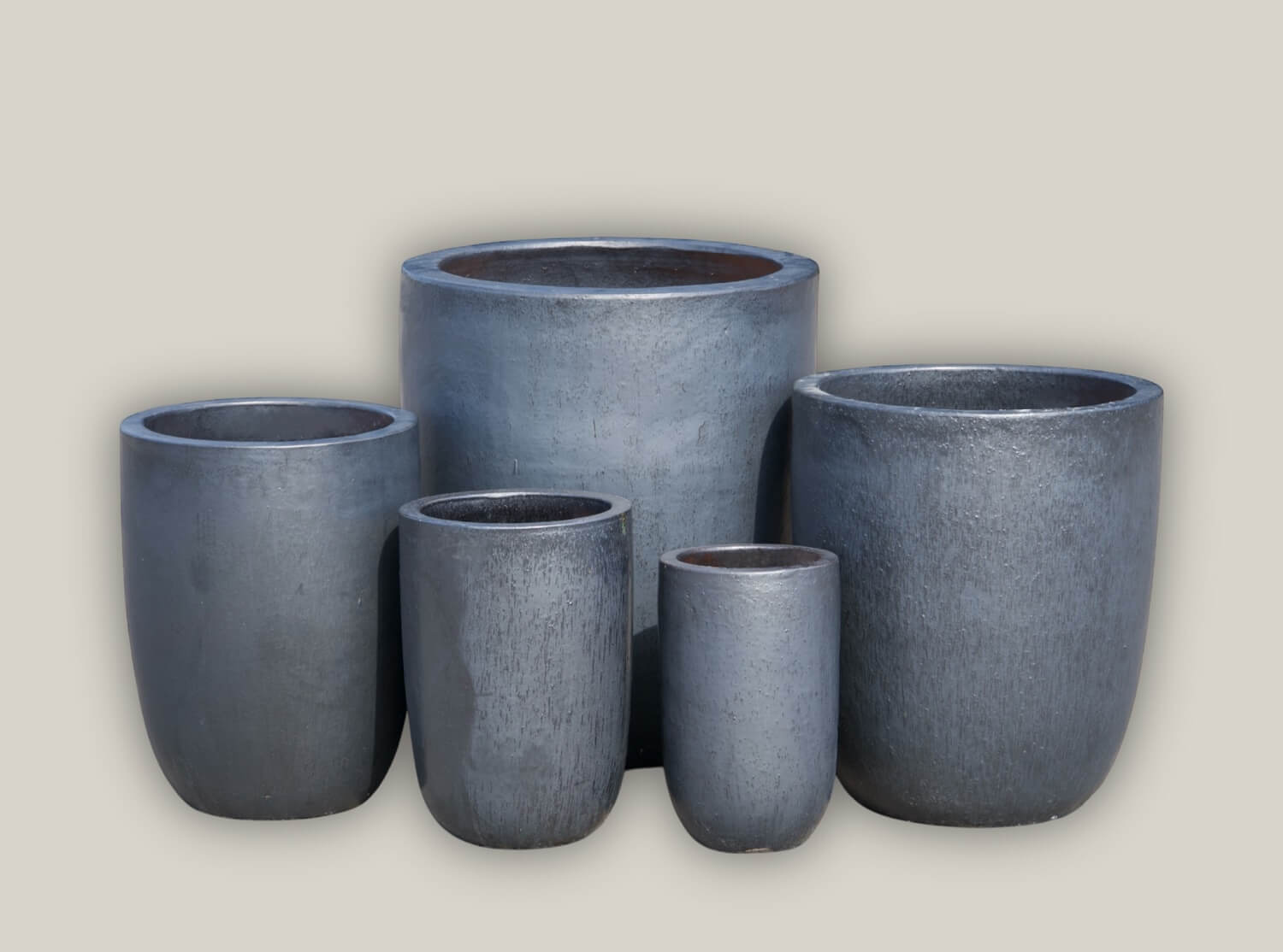 Modern tall planters in ceramic and stone finishes