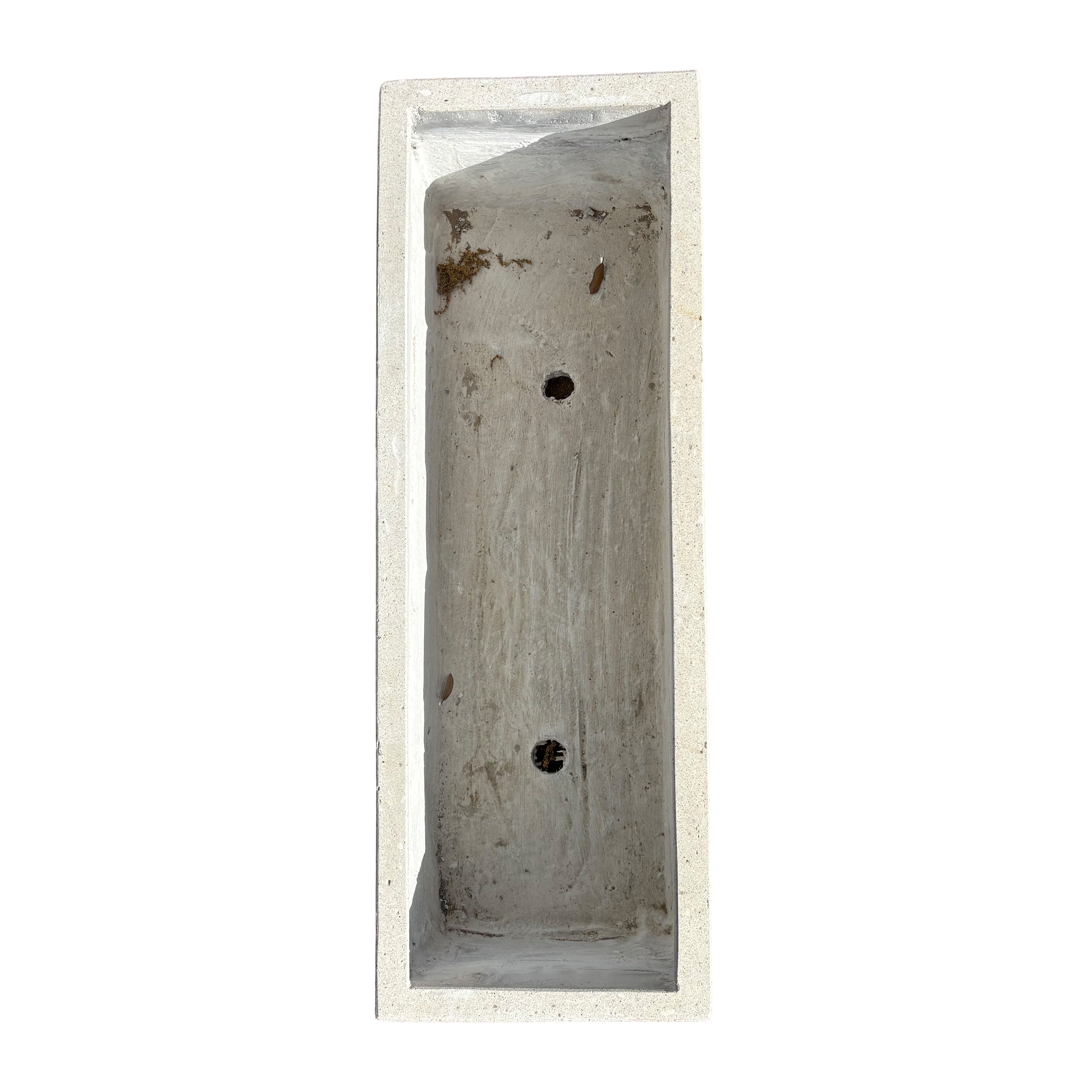 Top-down view of low white rectangular fiberstone planter, emphasizing its rectangular opening and compact, streamlined proportions.