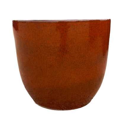 Tropical orange tapered round ceramic planter highlighting its tapered profile and vibrant glazed finish.