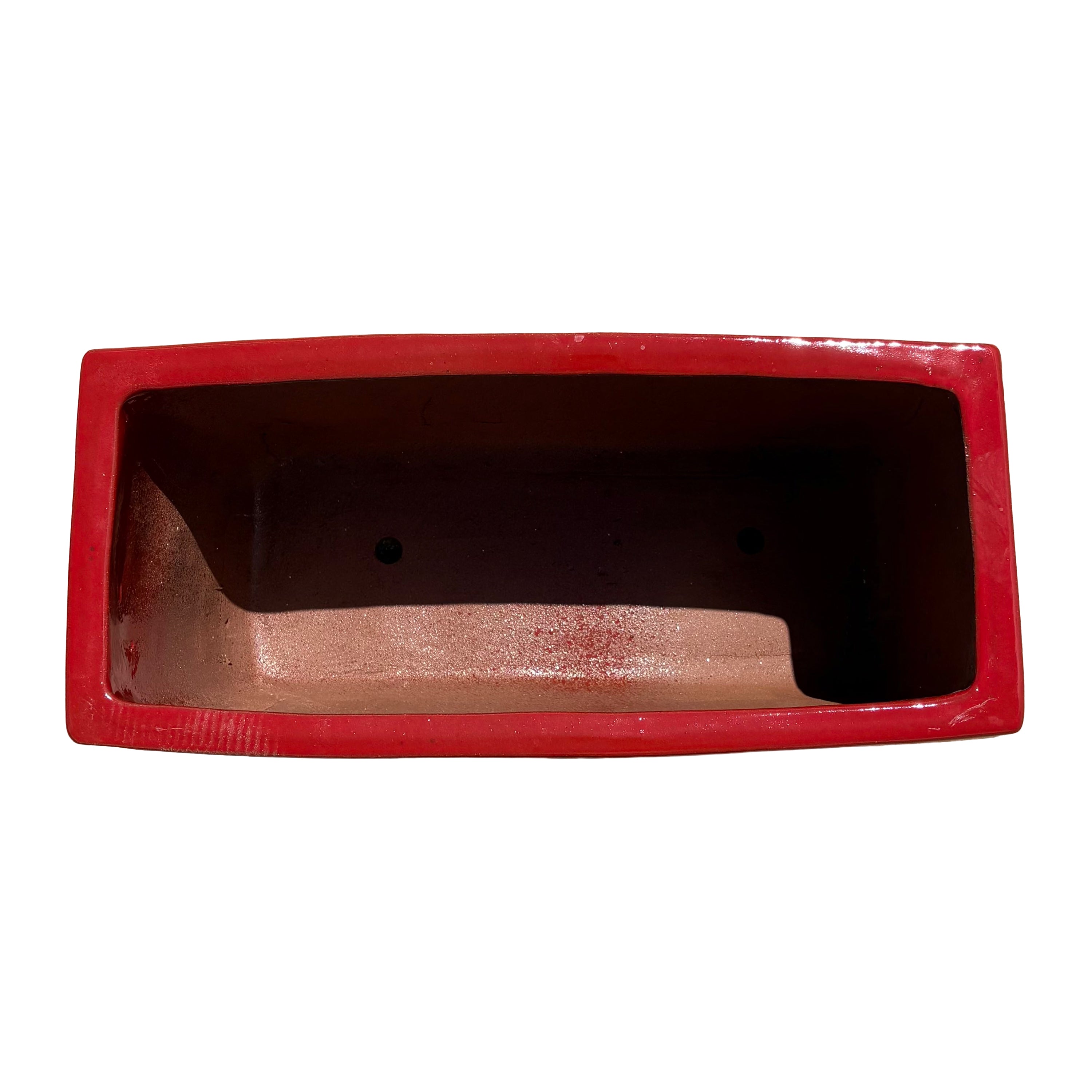 Top view of the bright red glazed rectangular ceramic planter showing the long planting area and smooth glazed interior.