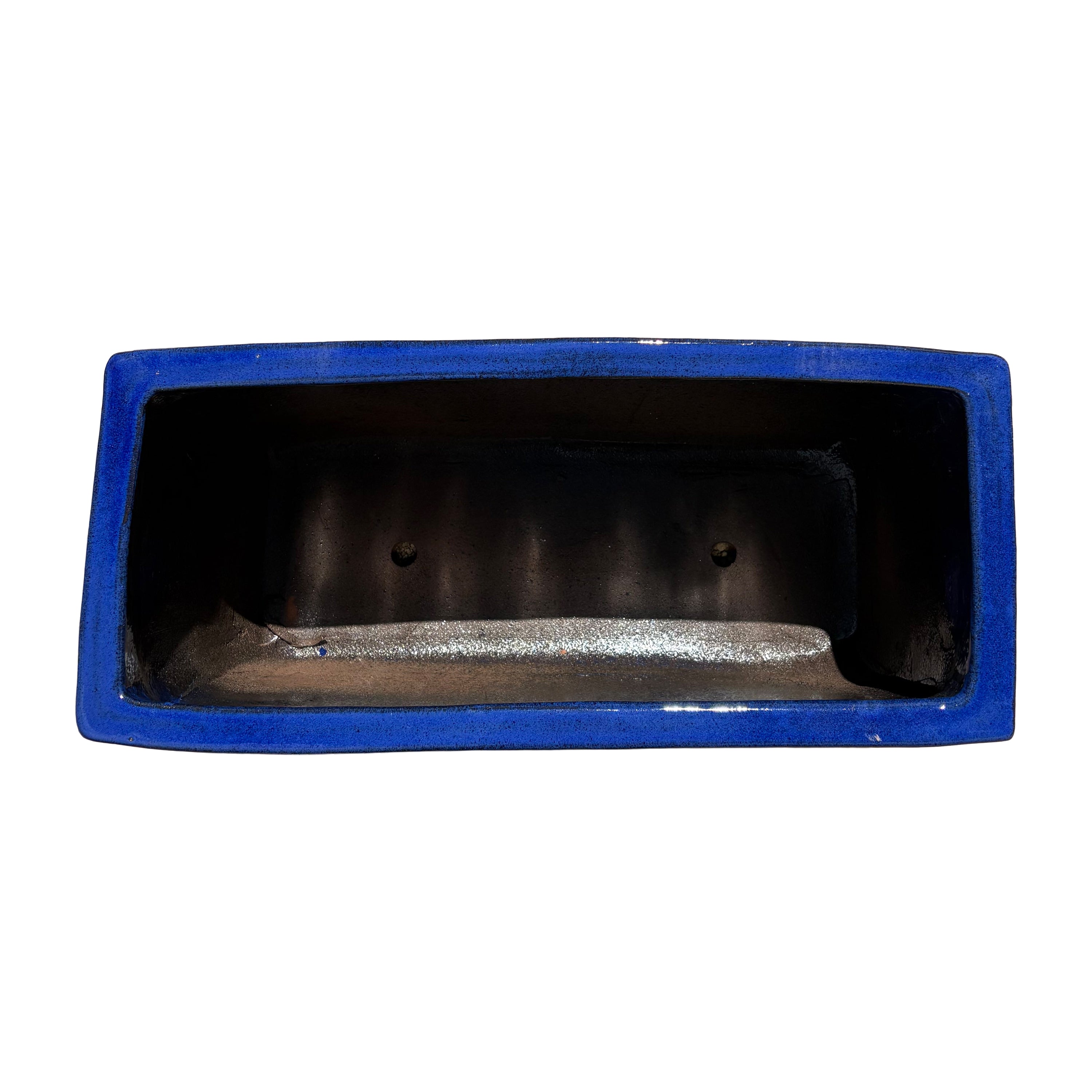 Top view of the falling blue glazed rectangular ceramic planter showing the wide planting space and smooth interior.