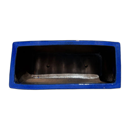 Top view of the falling blue glazed rectangular ceramic planter showing the wide planting space and smooth interior.