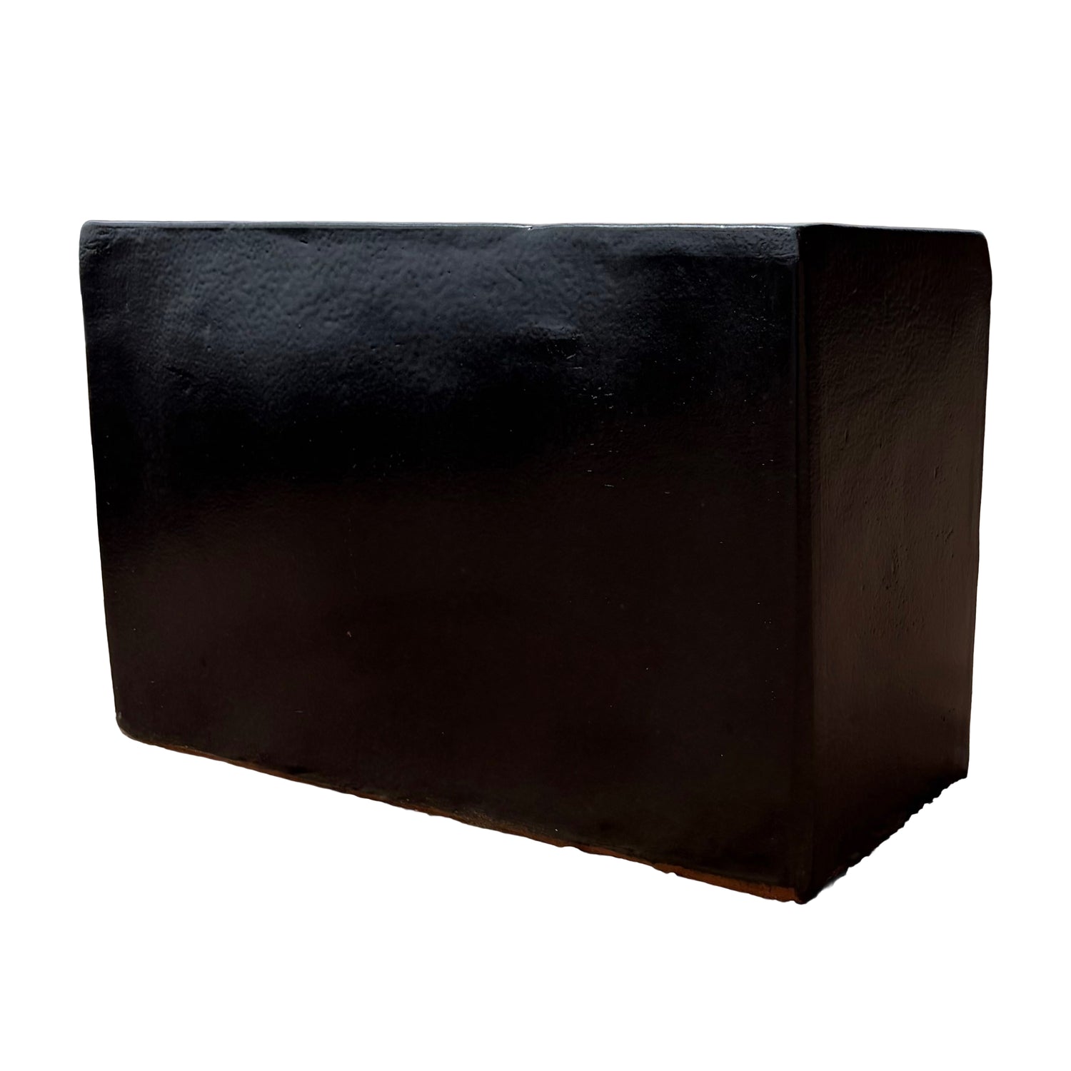 Matte black glazed rectangular ceramic planter shown from the side, highlighting its minimalist rectangular profile.