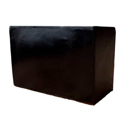 Matte black glazed rectangular ceramic planter shown from the side, highlighting its minimalist rectangular profile.