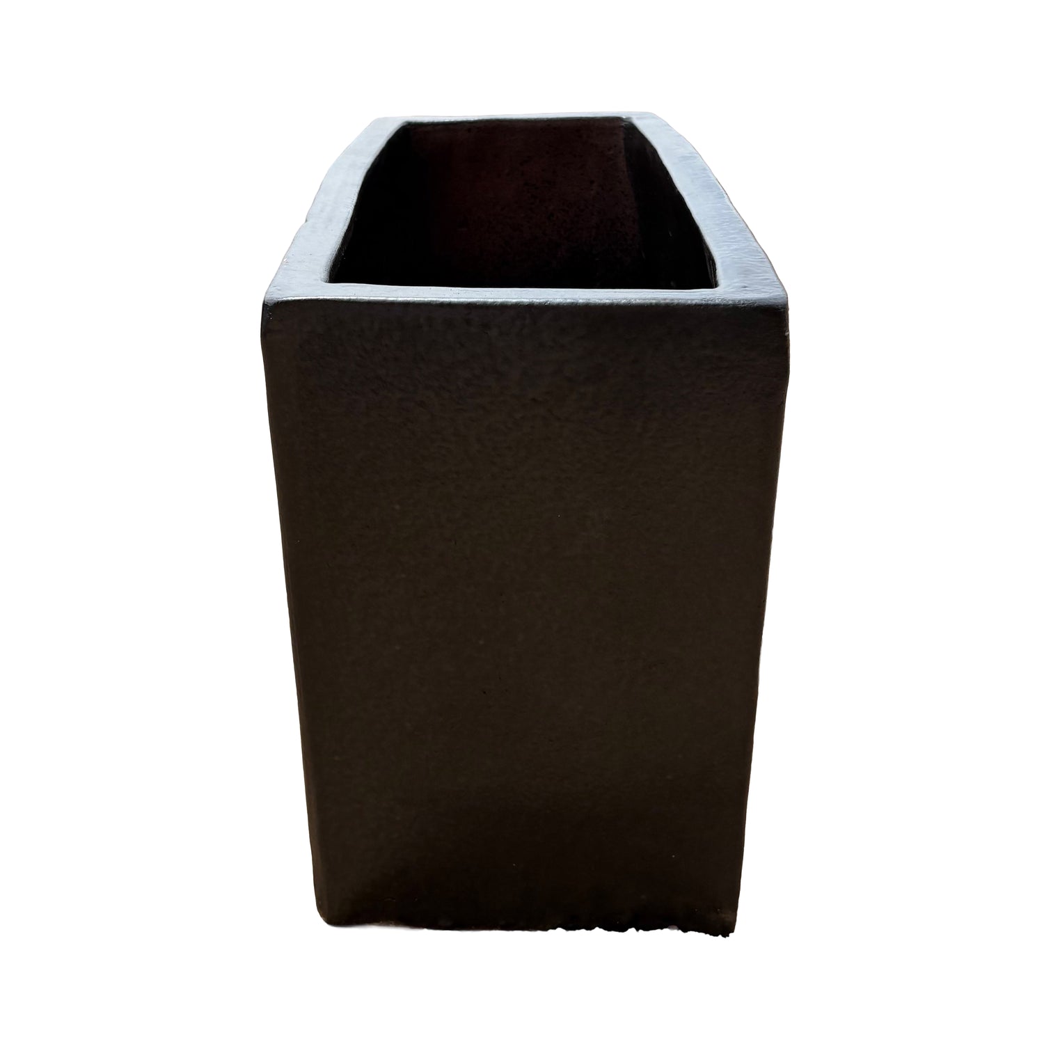 Short side view of the matte black glazed rectangular ceramic planter highlighting its compact end profile and matte surface.