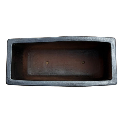 Top view of the matte black glazed rectangular ceramic planter showing the elongated planting space and smooth interior finish.