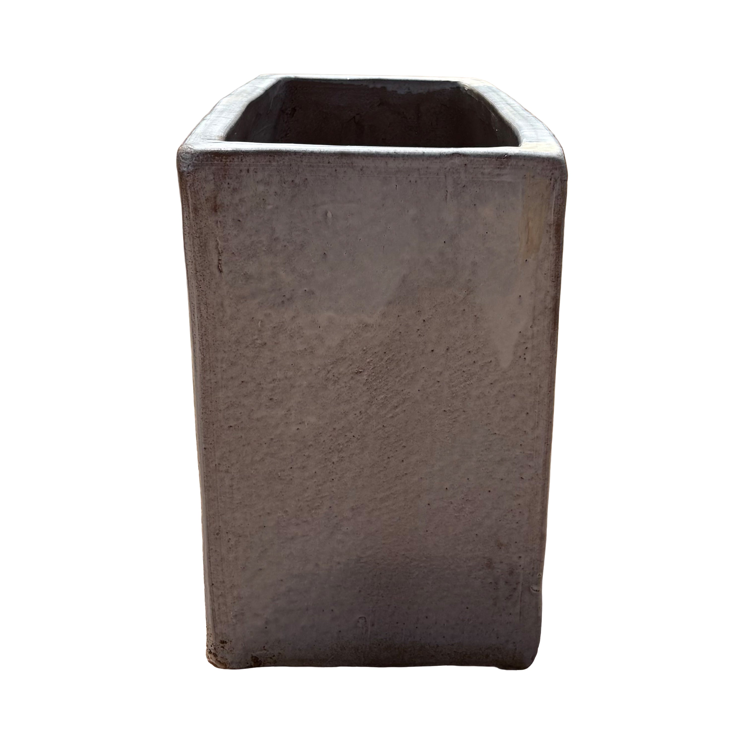 Short side view of the white glazed rectangular ceramic planter highlighting its compact end profile and glossy white finish.