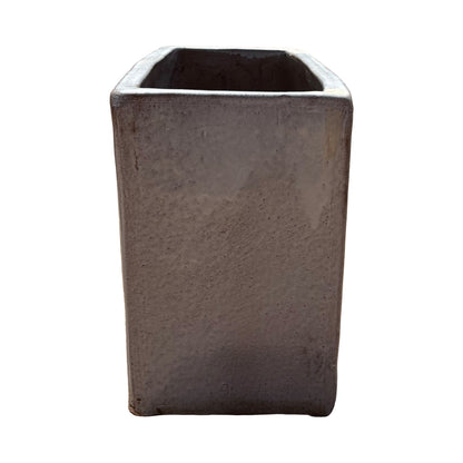 Short side view of the white glazed rectangular ceramic planter highlighting its compact end profile and glossy white finish.