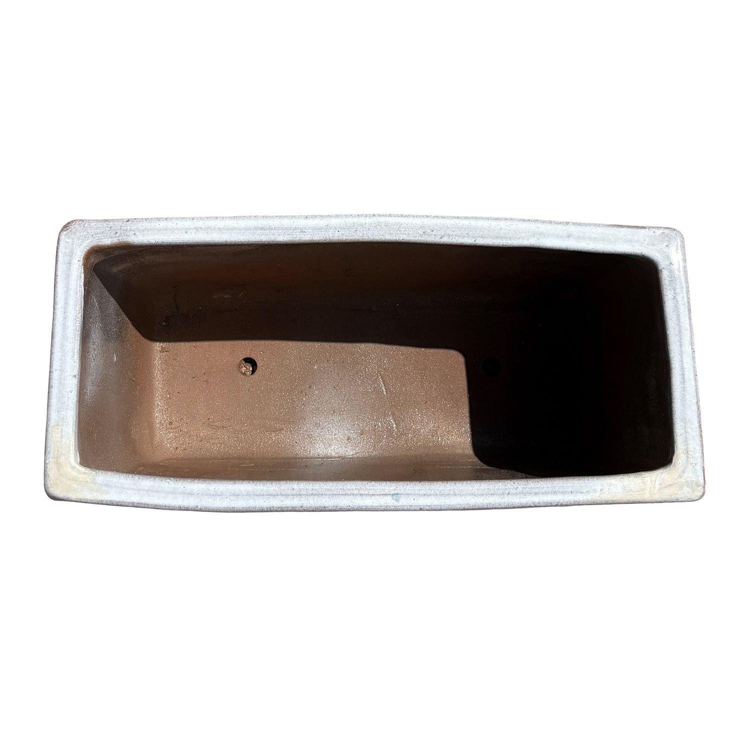 Top view of the white glazed rectangular ceramic planter showing the long planting space and clean interior surface.