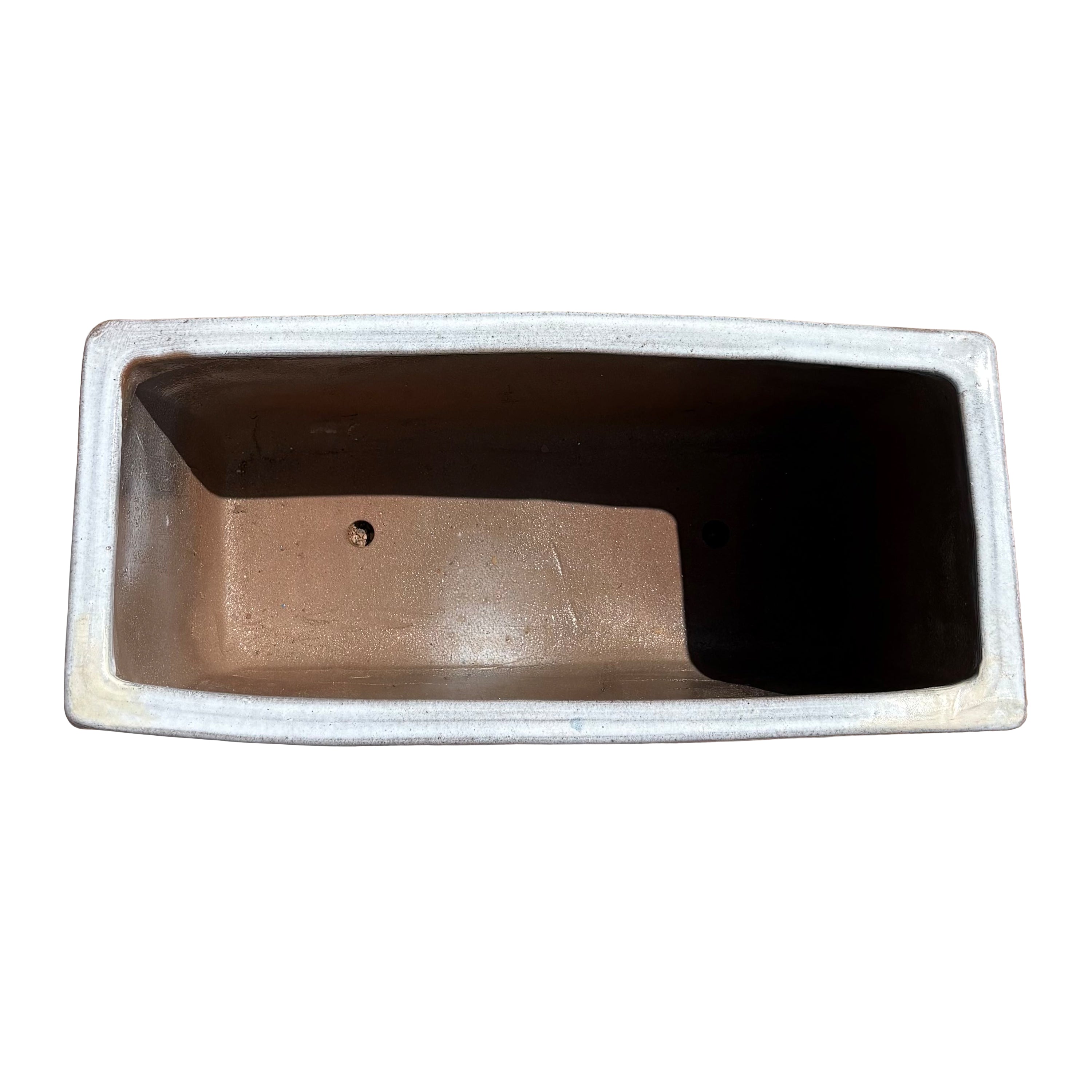 Top view of the white glazed rectangular ceramic planter showing the long planting space and clean interior surface.