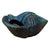 Slightly angled view of Marble Green ceramic conch planter showcasing the sculpted shell design and glazed finish