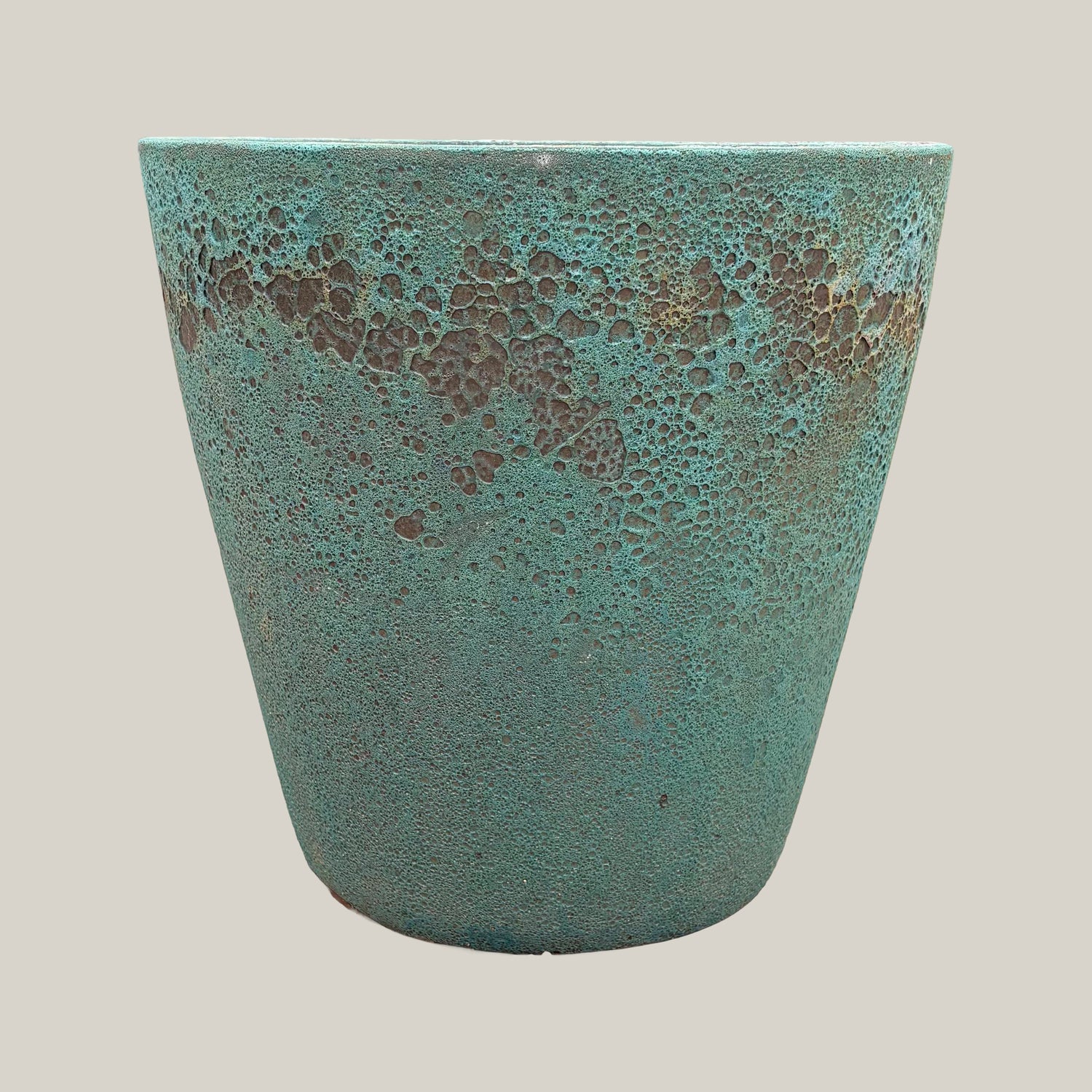 Front view of marble green coral tapered planter with clean tapered silhouette and decorative textured coral rim
