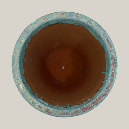 Top view of marble green coral tapered planter showing wide circular opening and interior finish