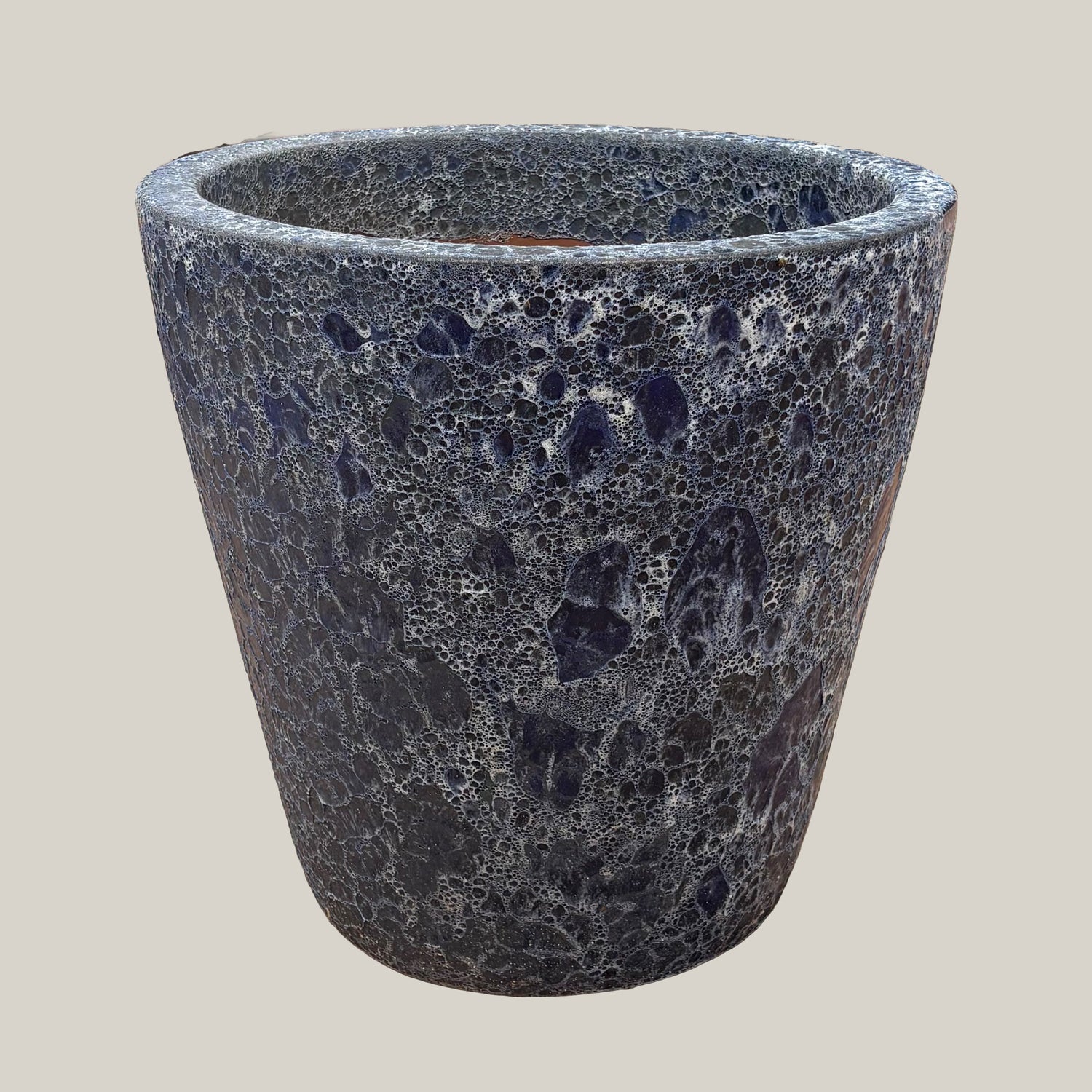 Blue coral tapered planter with wide tapered shape, textured blue-gray crackled finish, slightly angled view highlighting stone-like surface detail